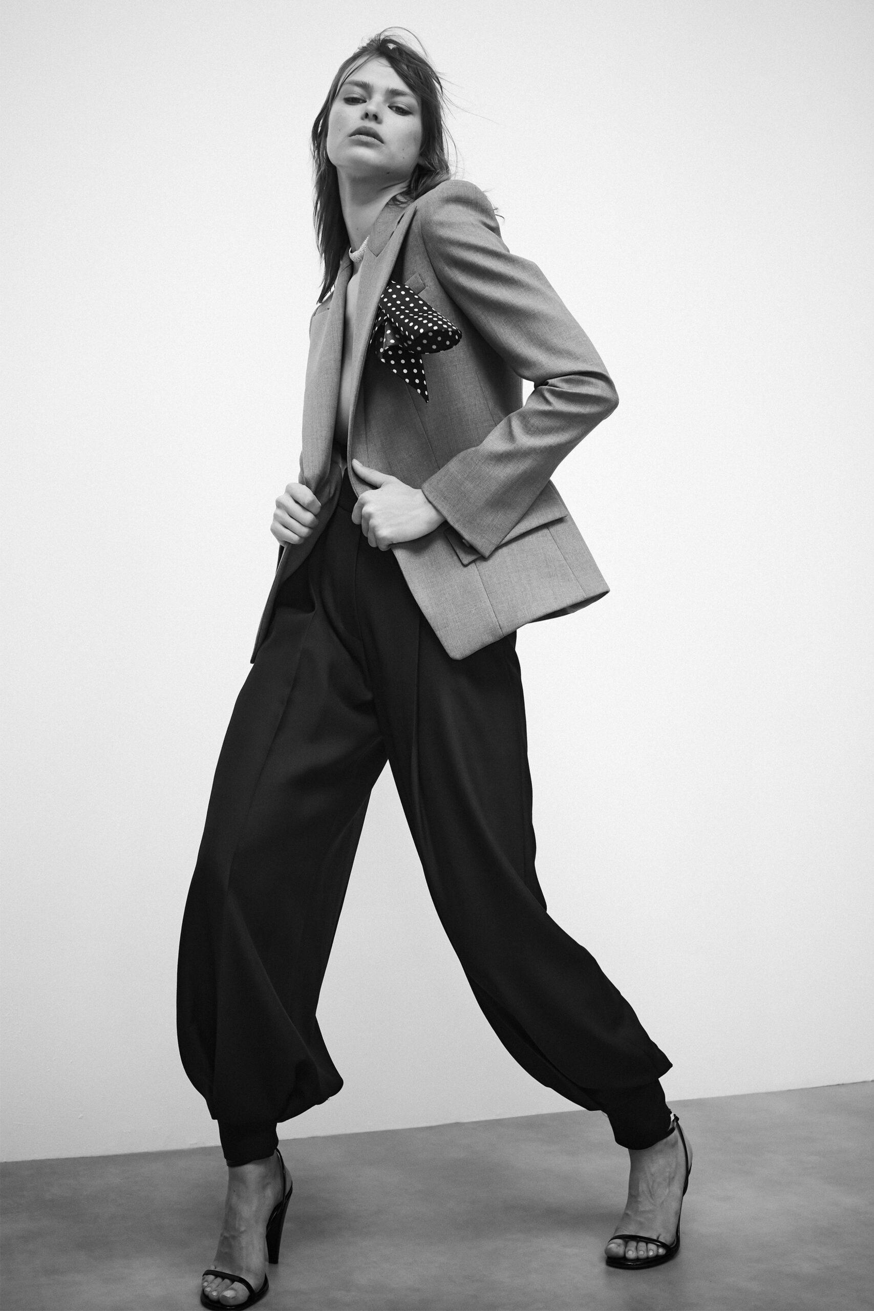 gray tailored blazer with black pants