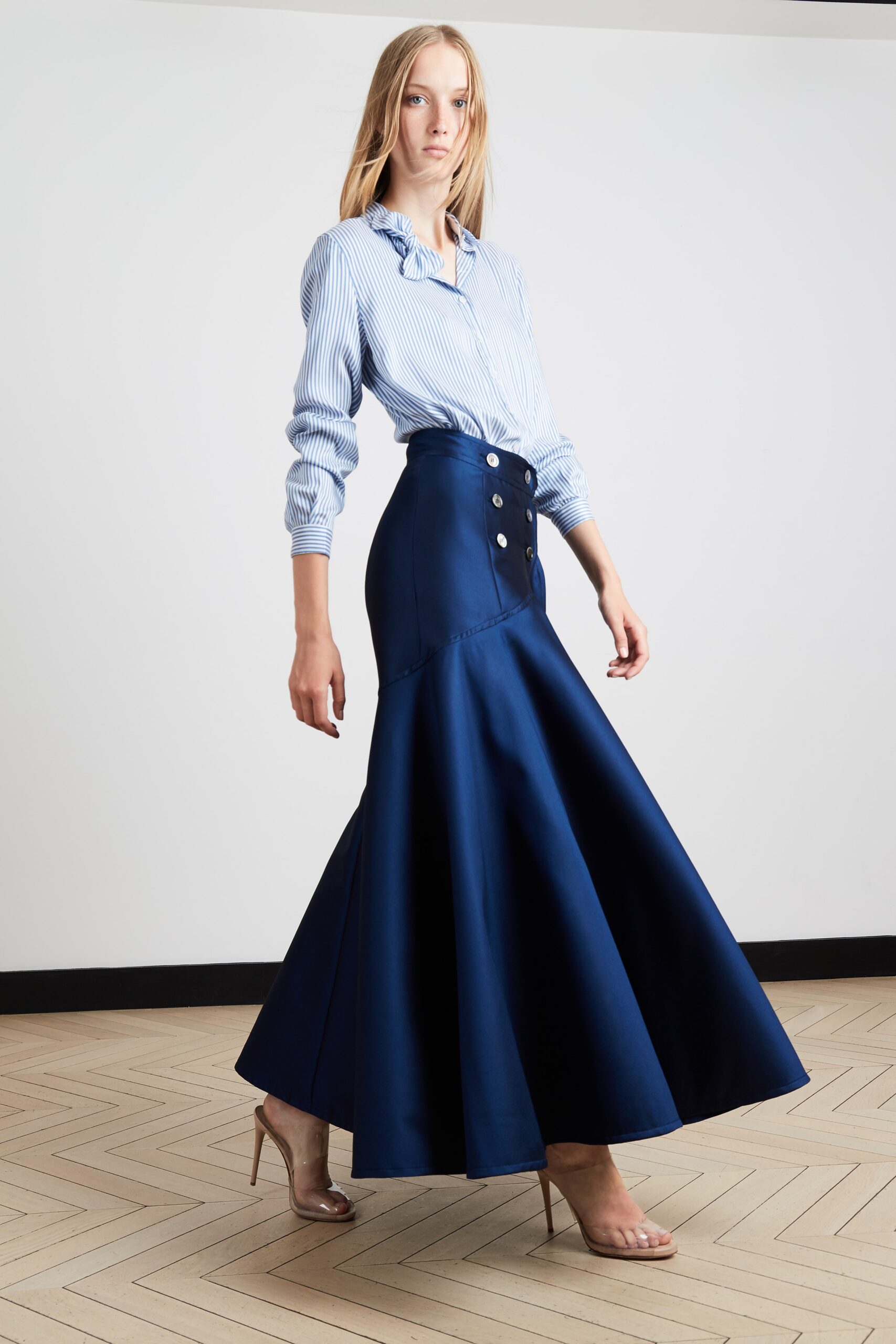 blue striped shirt and navy flared skirt