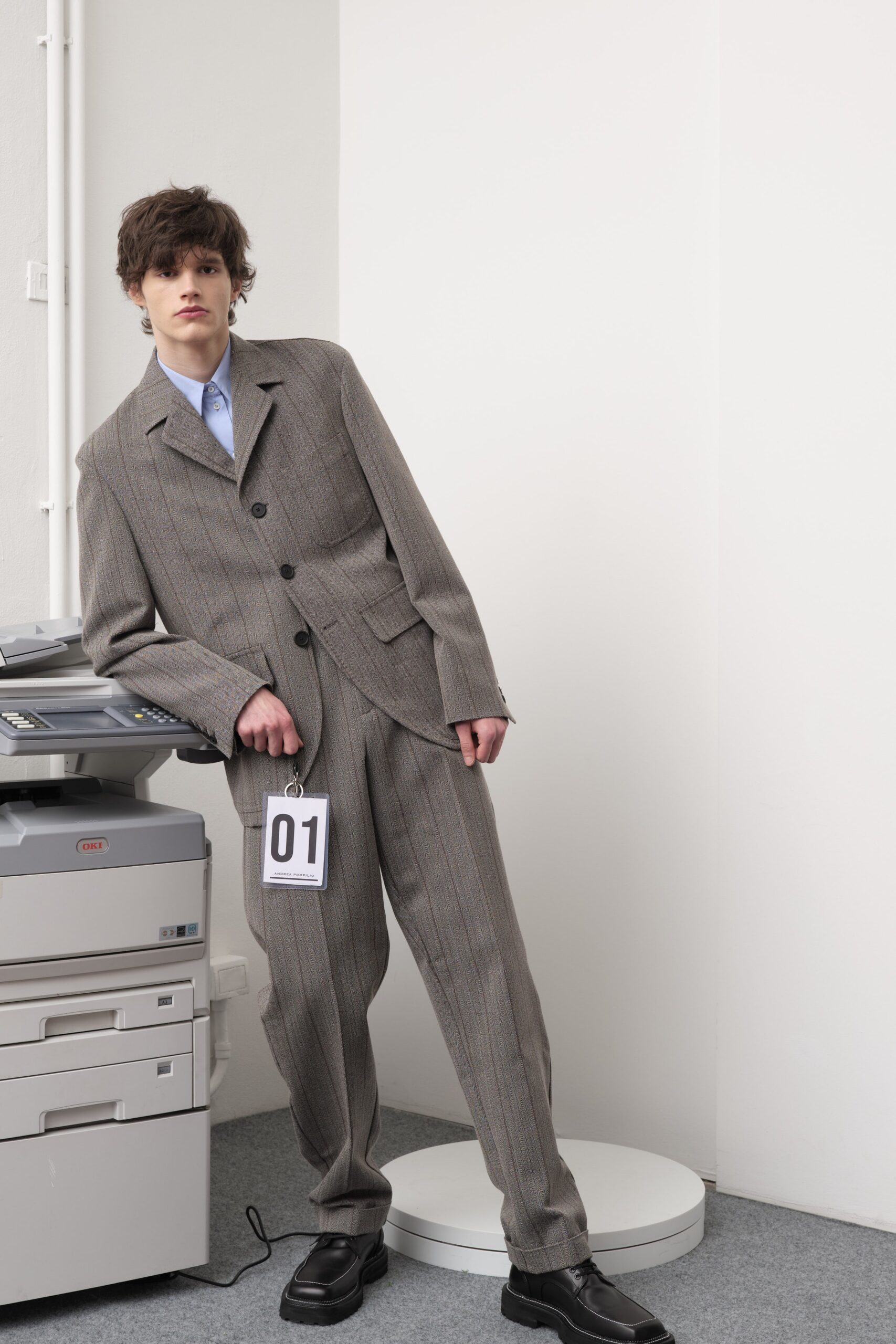 gray tailored suit with blue shirt