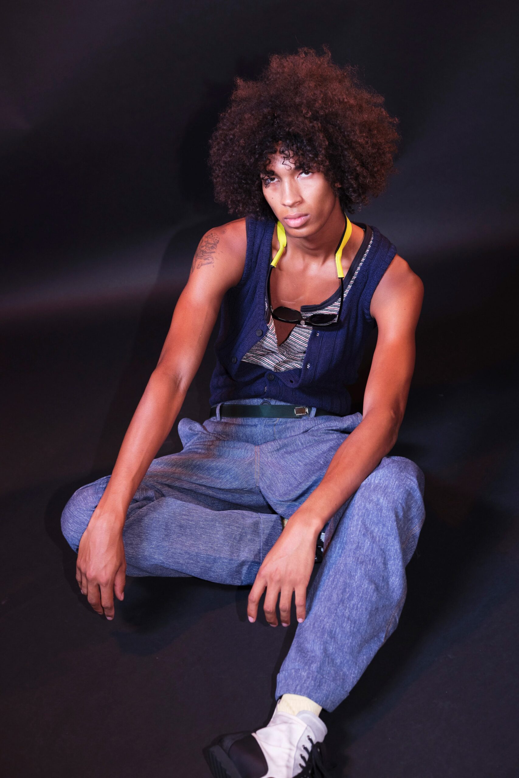 blue cotton vest with gray pants