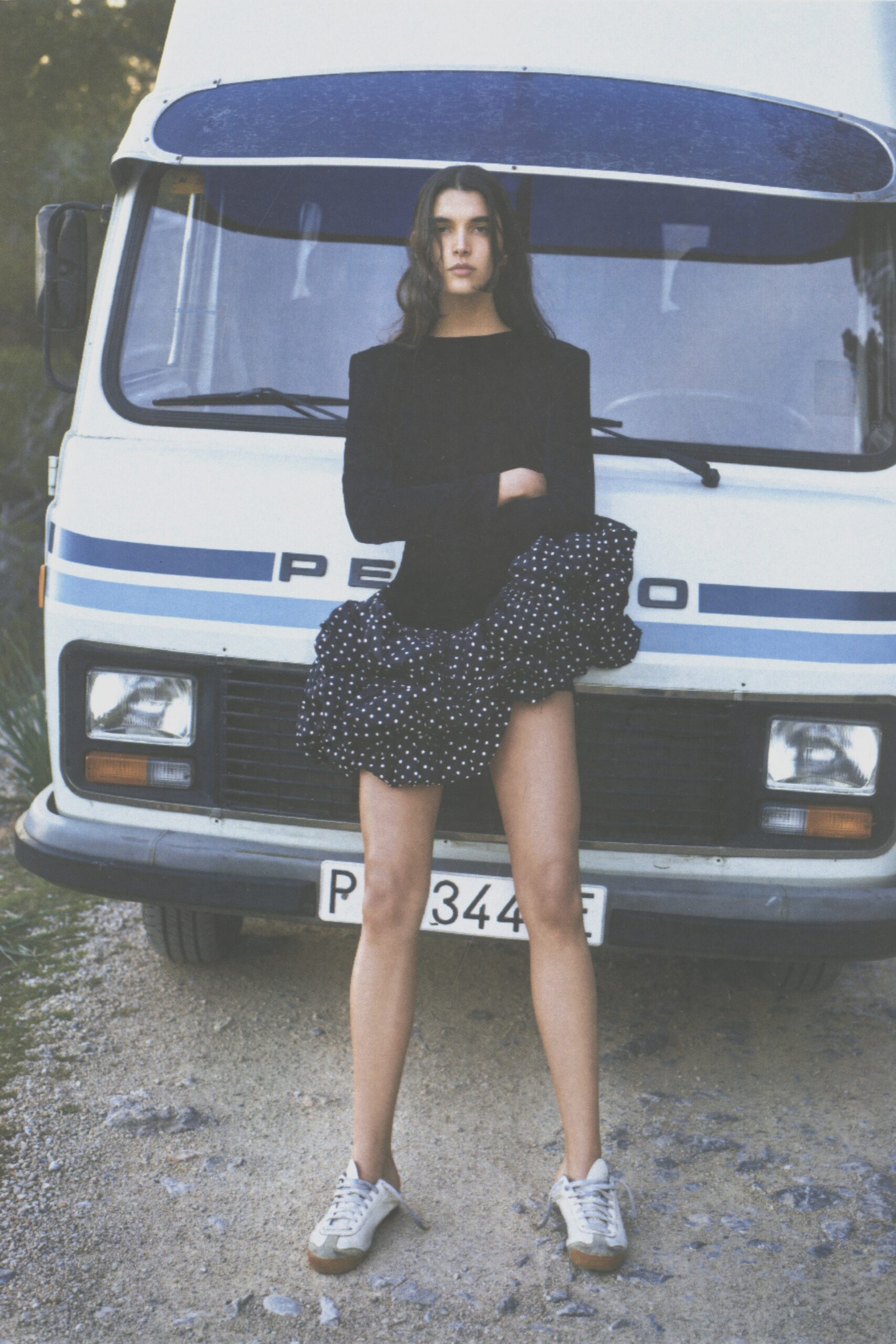 black fitted top with ruffled mini skirt