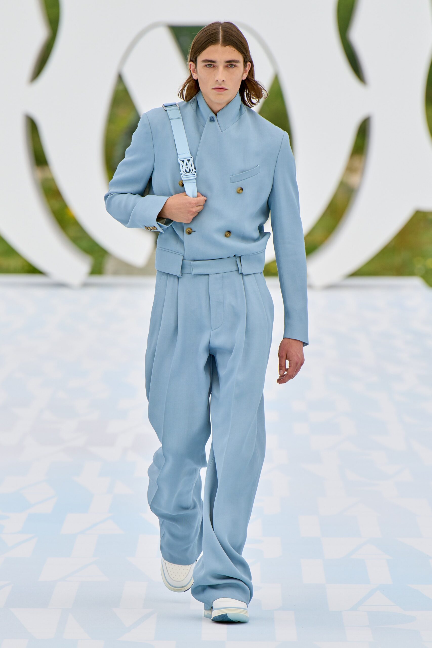 blue tailored suit with white shoes