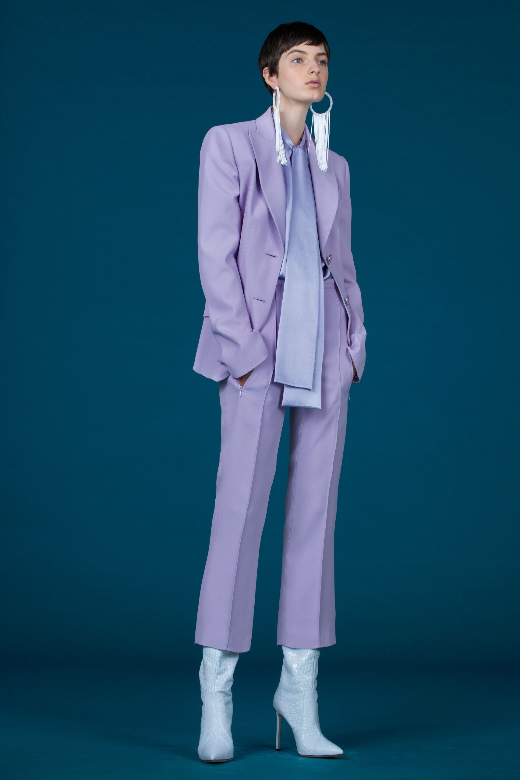 purple tailored suit with shiny boots