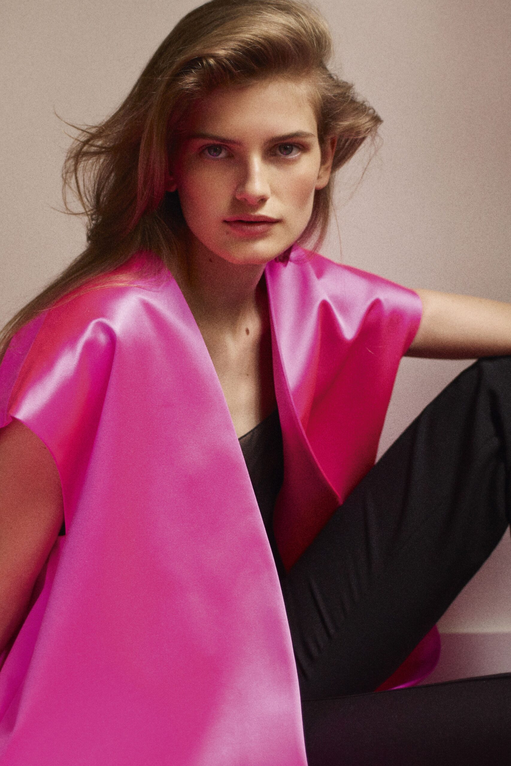 pink silk top with black pants