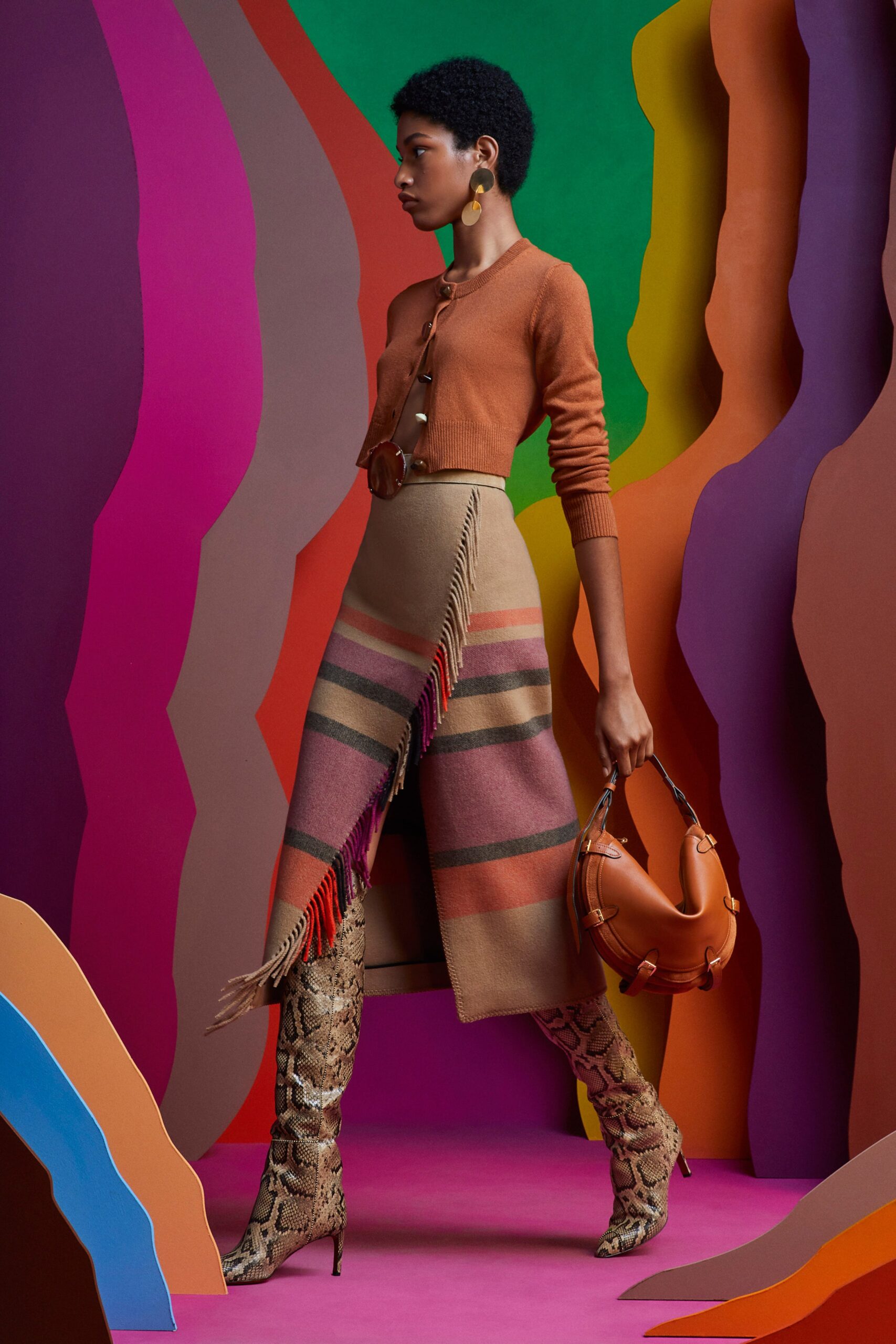 orange fitted sweater with midi skirt