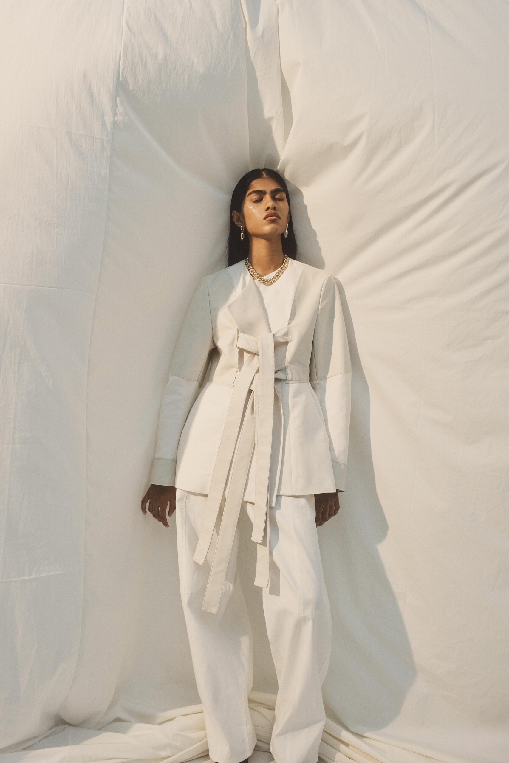 white tailored blazer and relaxed pants