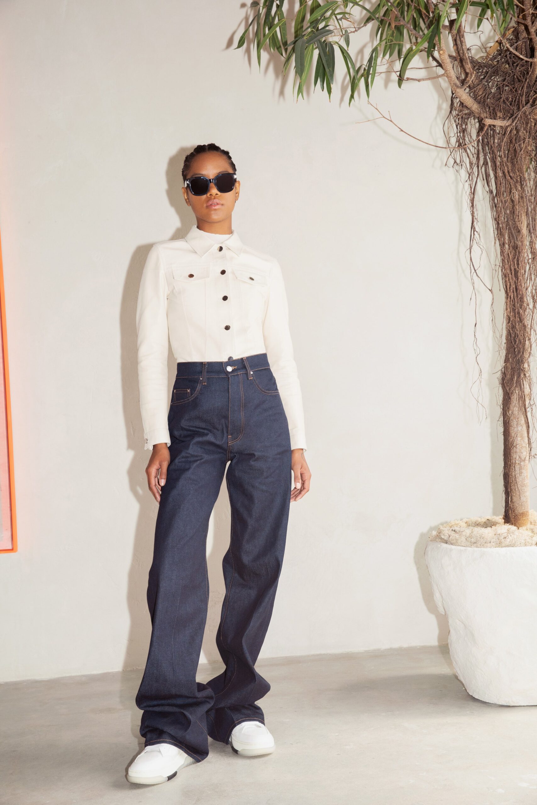 white fitted shirt and blue pants