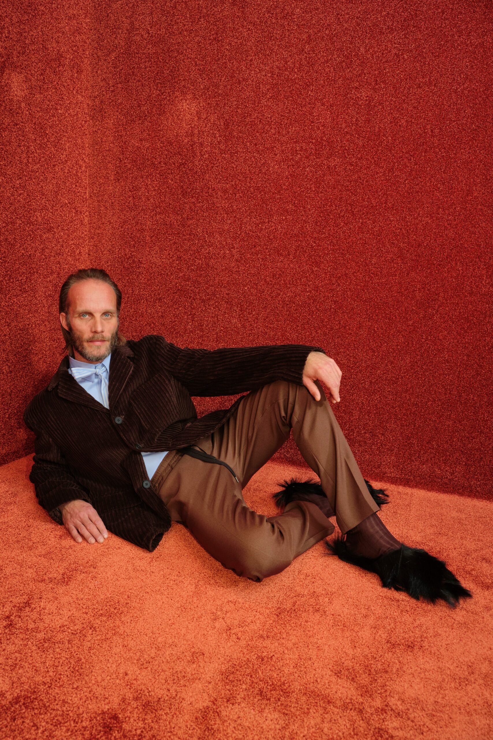 brown velvet fitted jacket with blue shirt