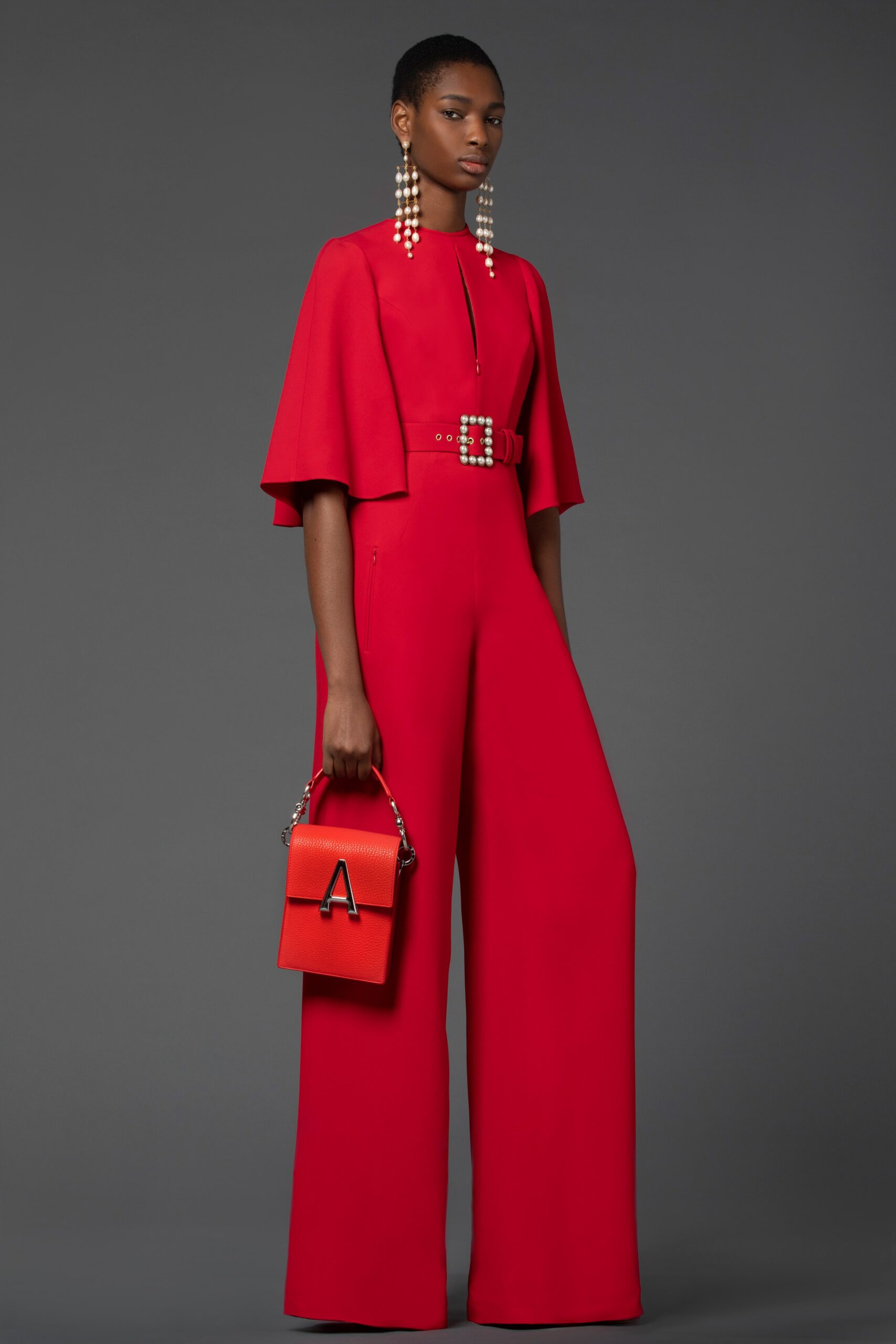 red sleeveless collared fitted belted wide-leg jumpsuit