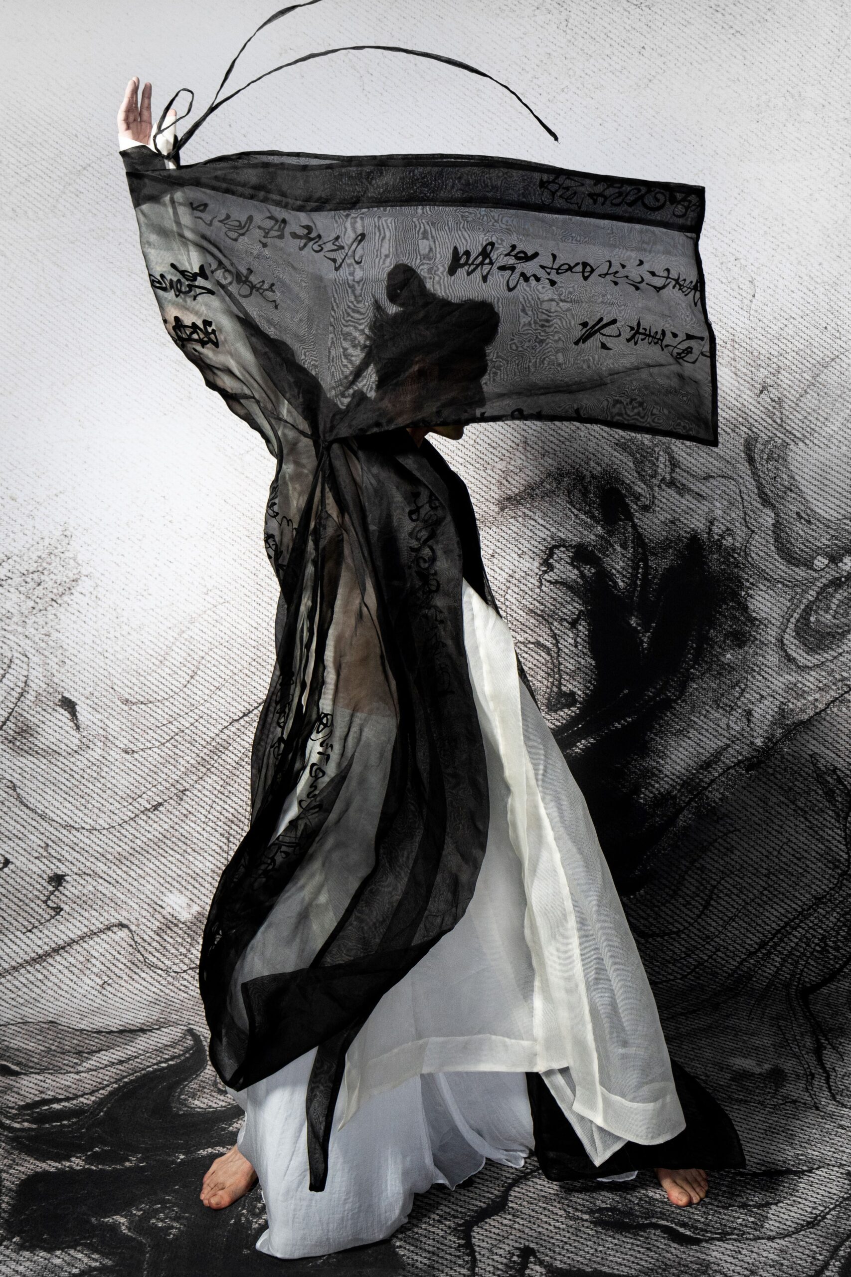 black silk cape and white dress