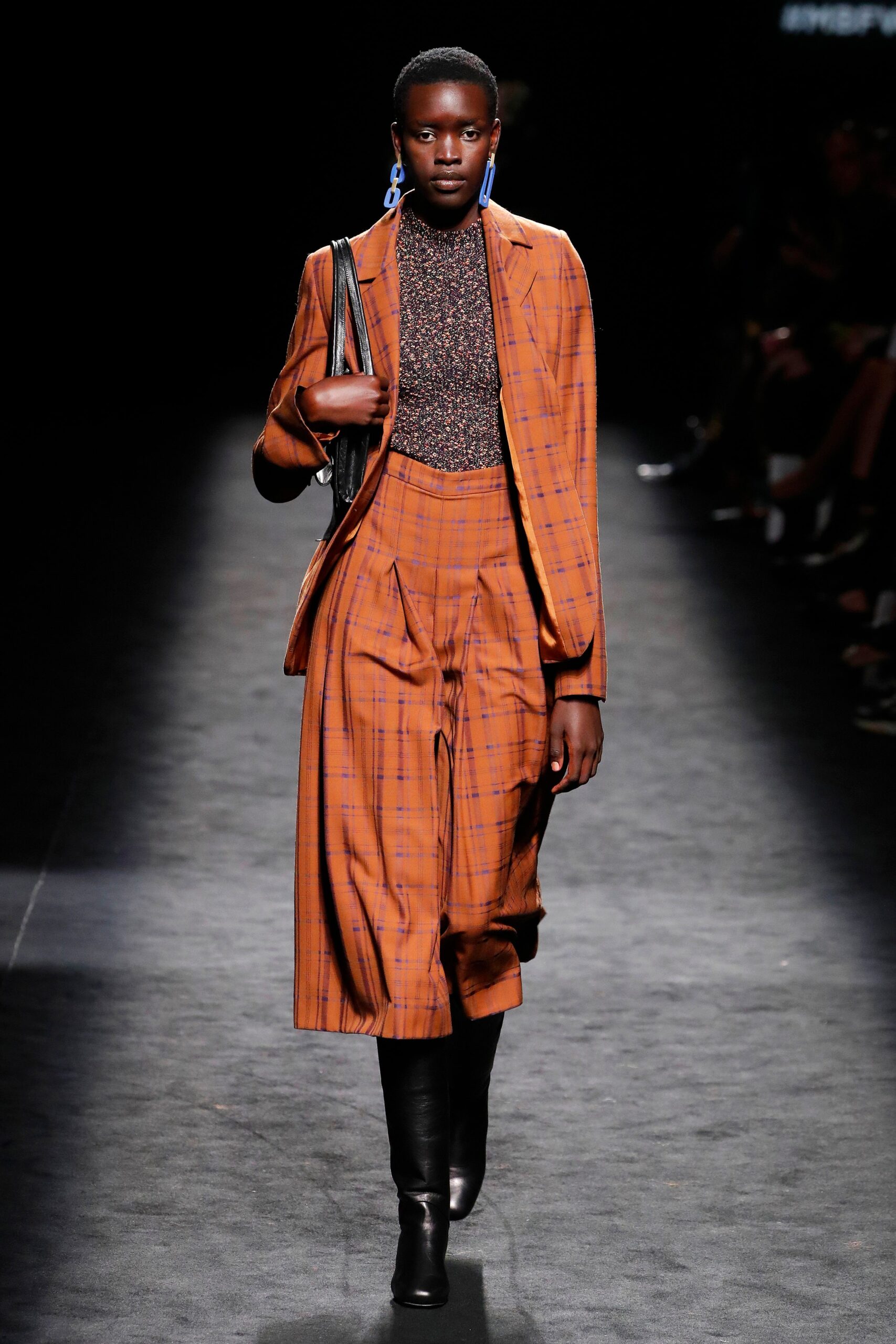 orange checked suit with black boots
