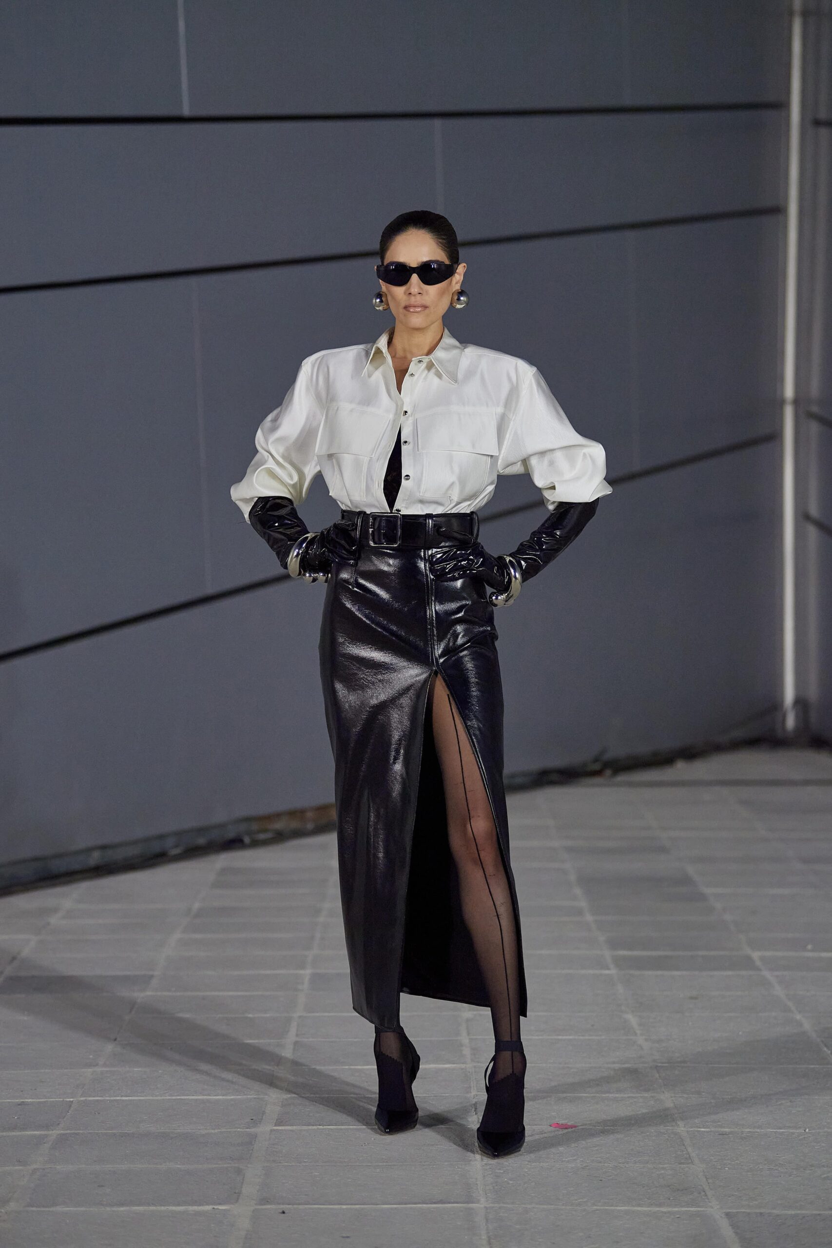 white relaxed blouse and black leather skirt
