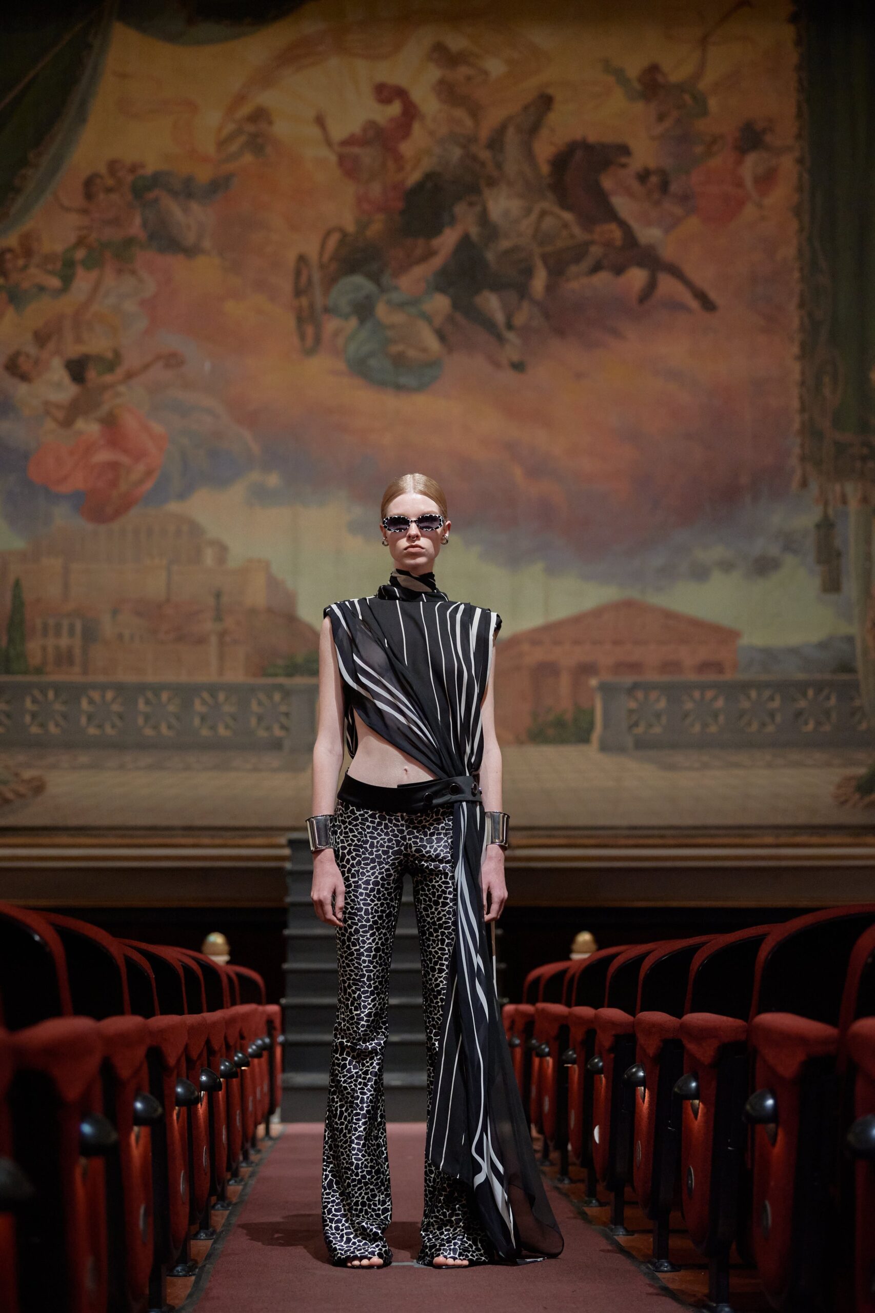 black and white striped top with flared pants