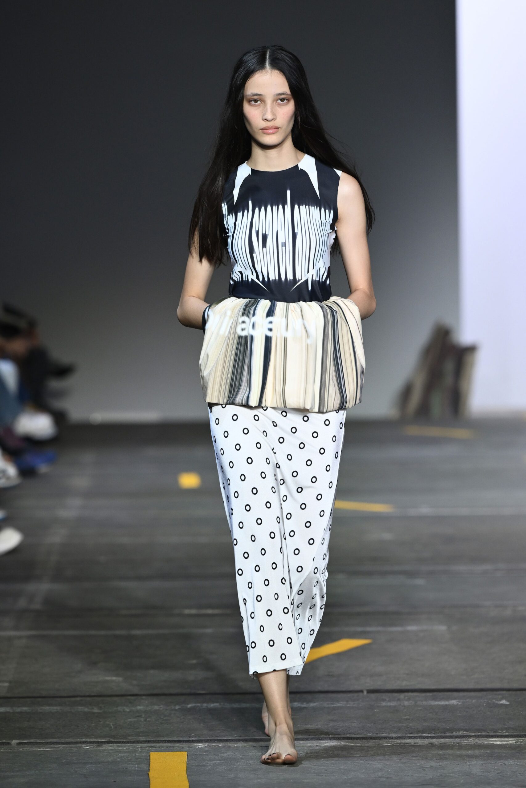 black and white printed top with polka-dot skirt