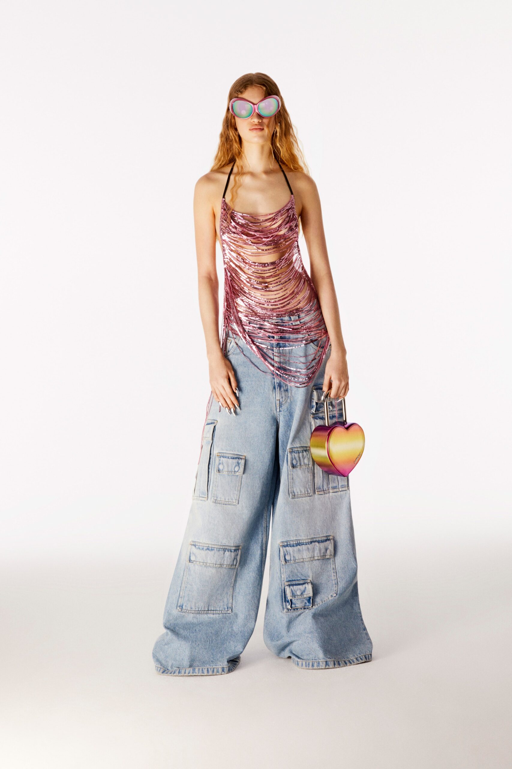 pink ruched top with relaxed denim pants