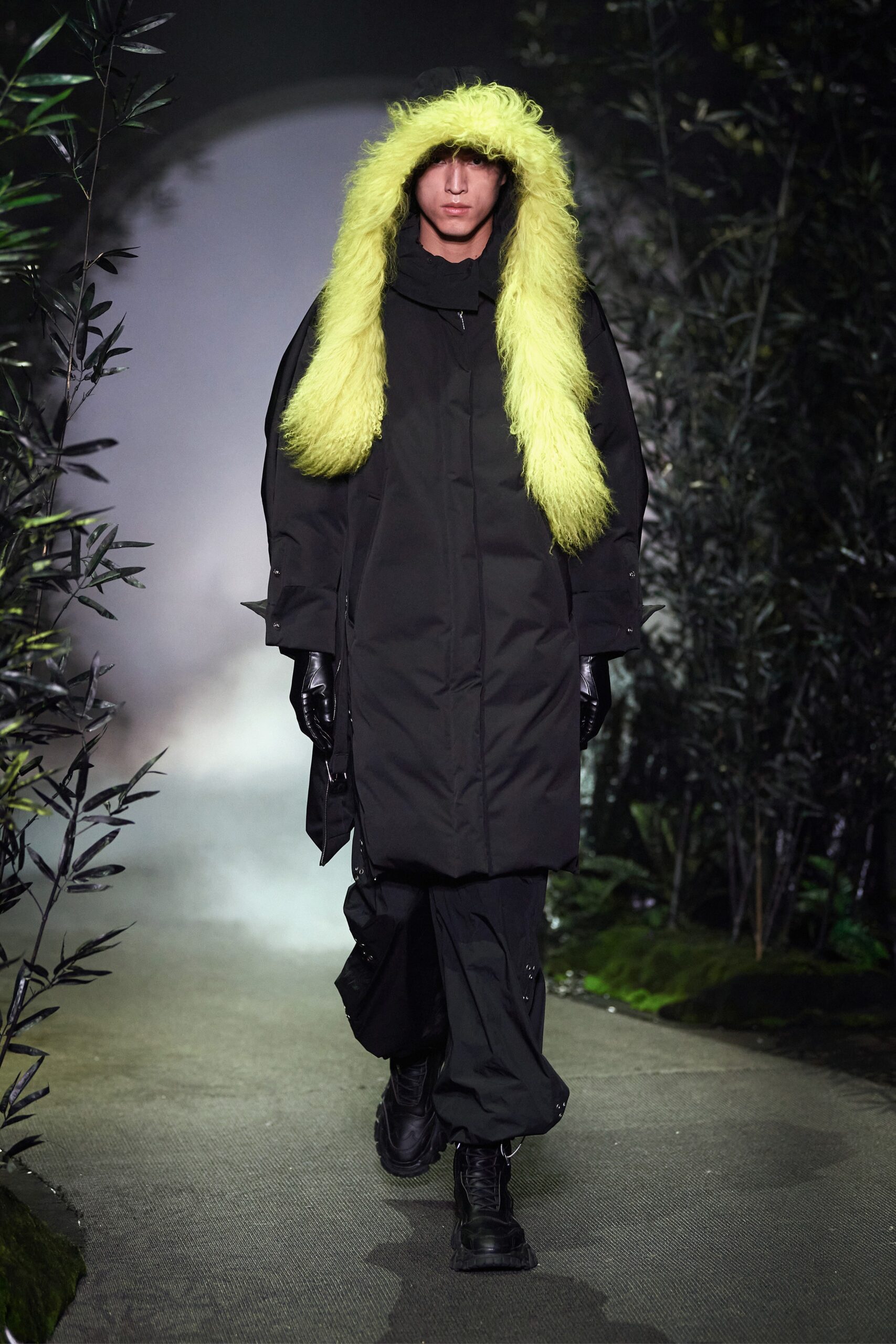 black coat with yellow scarf