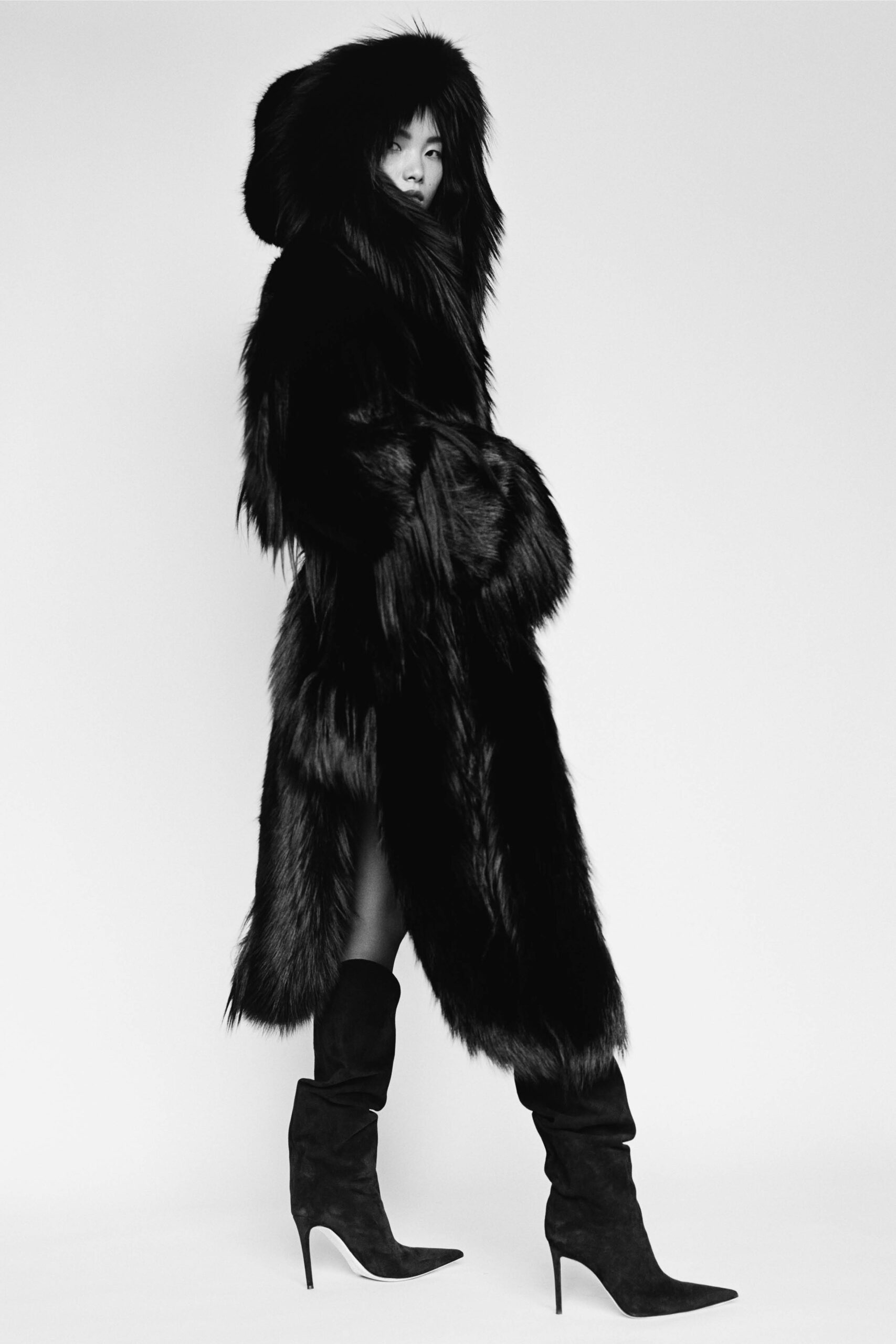 black fur coat with high-heeled boots