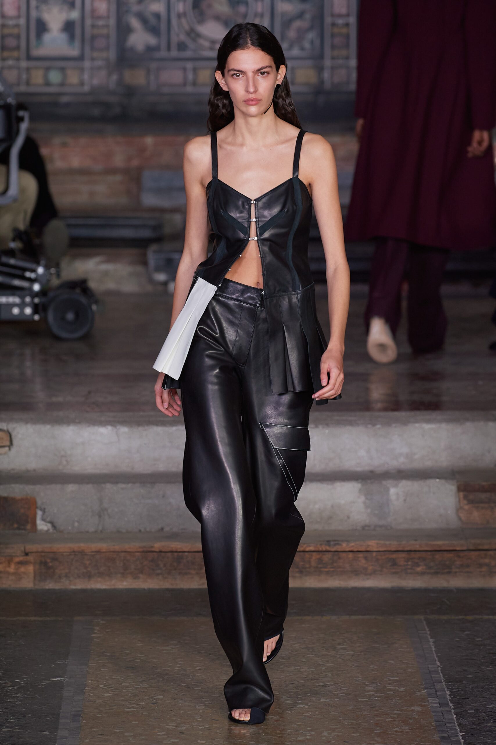black leather sleeveless v-neck fitted zippered pleated top
