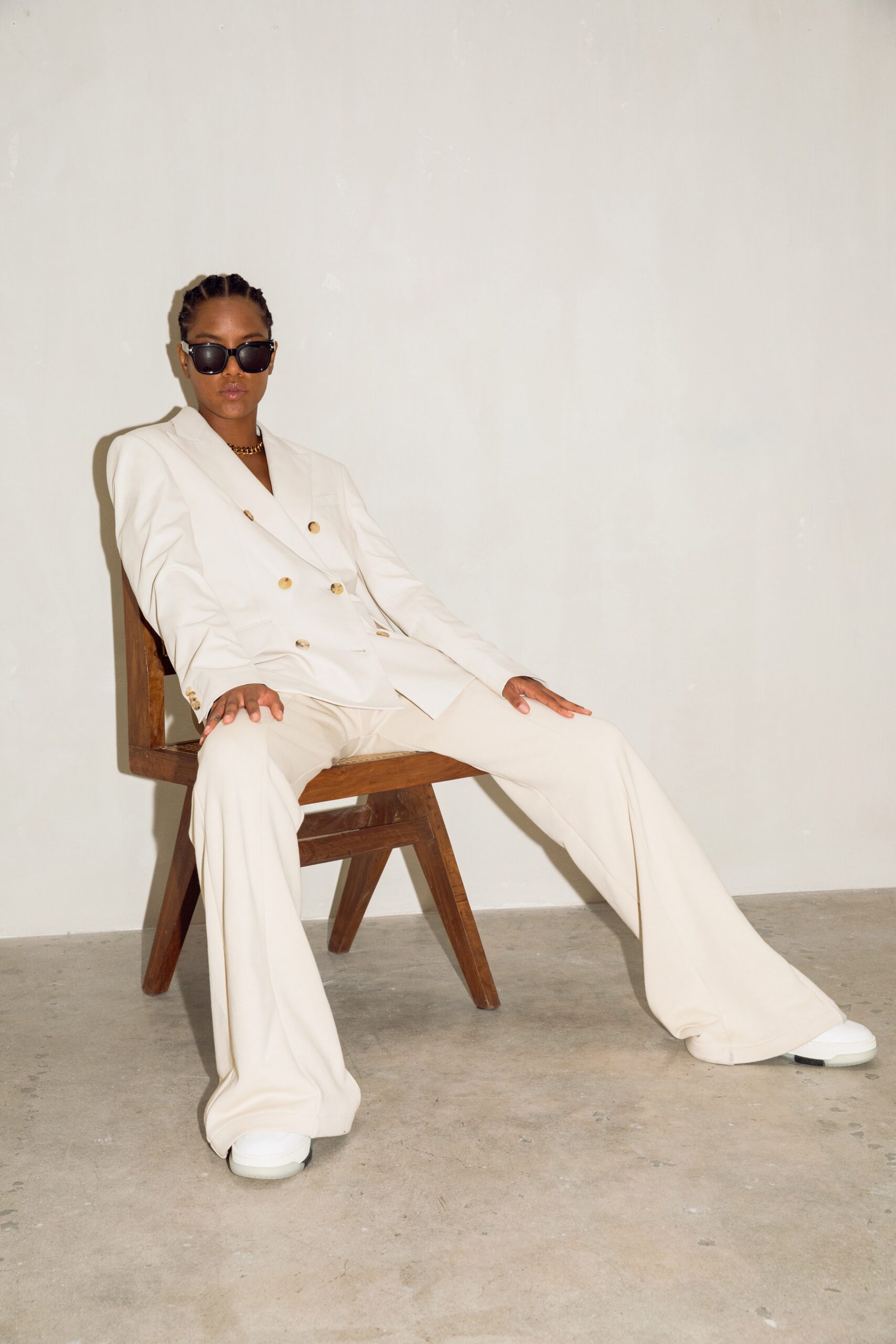 white tailored suit with sunglasses