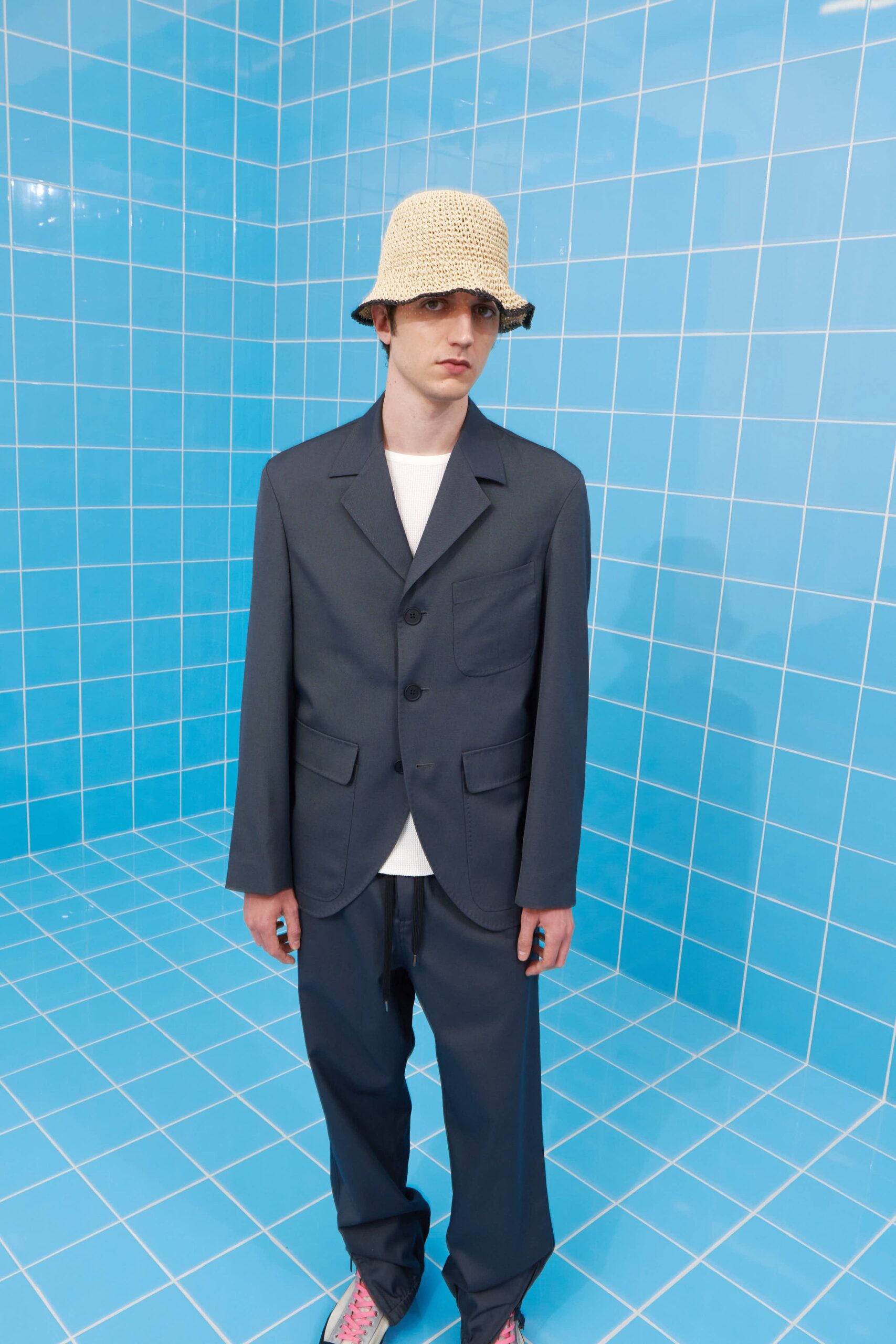 gray tailored suit with white t-shirt