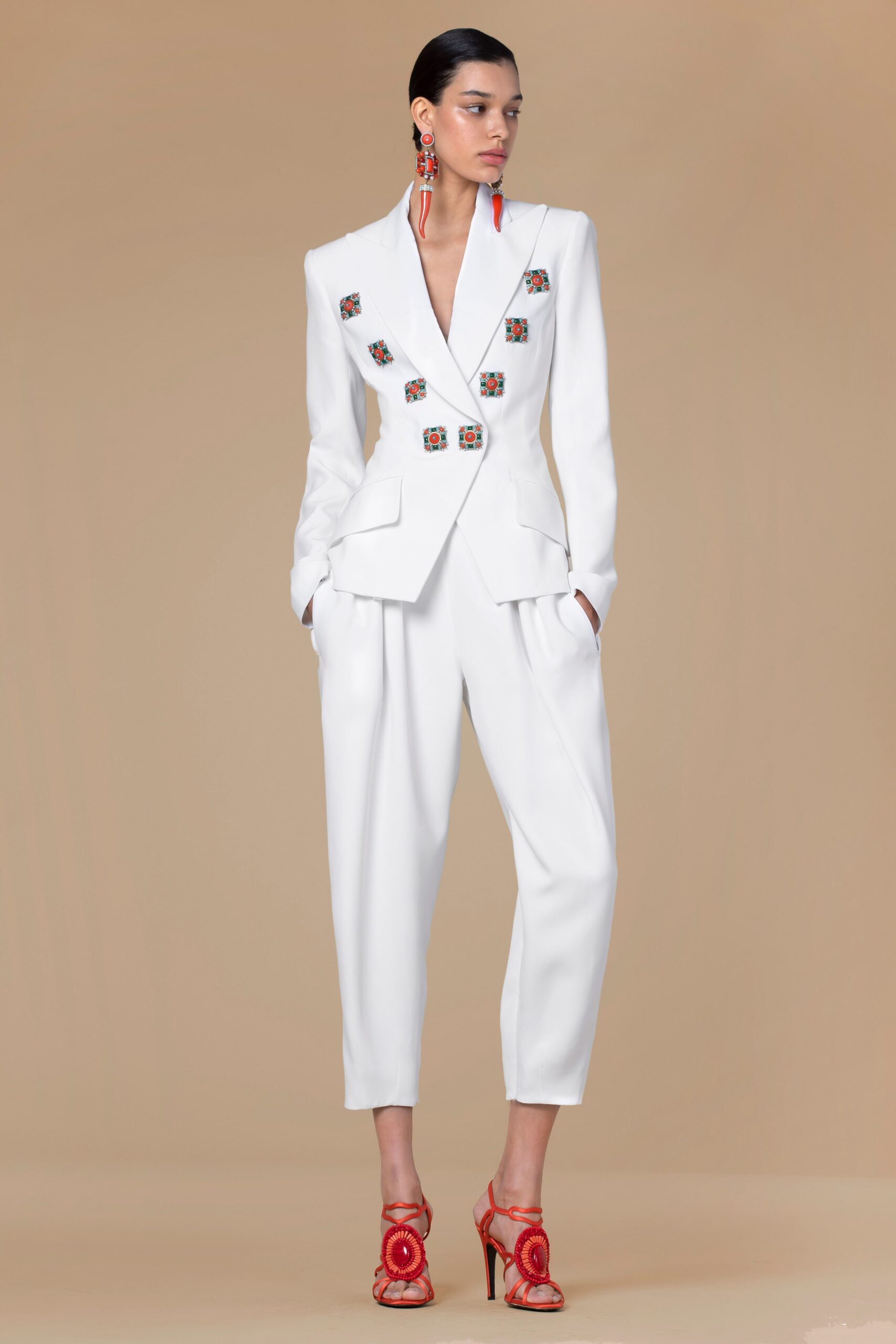 white tailored suit with red heels