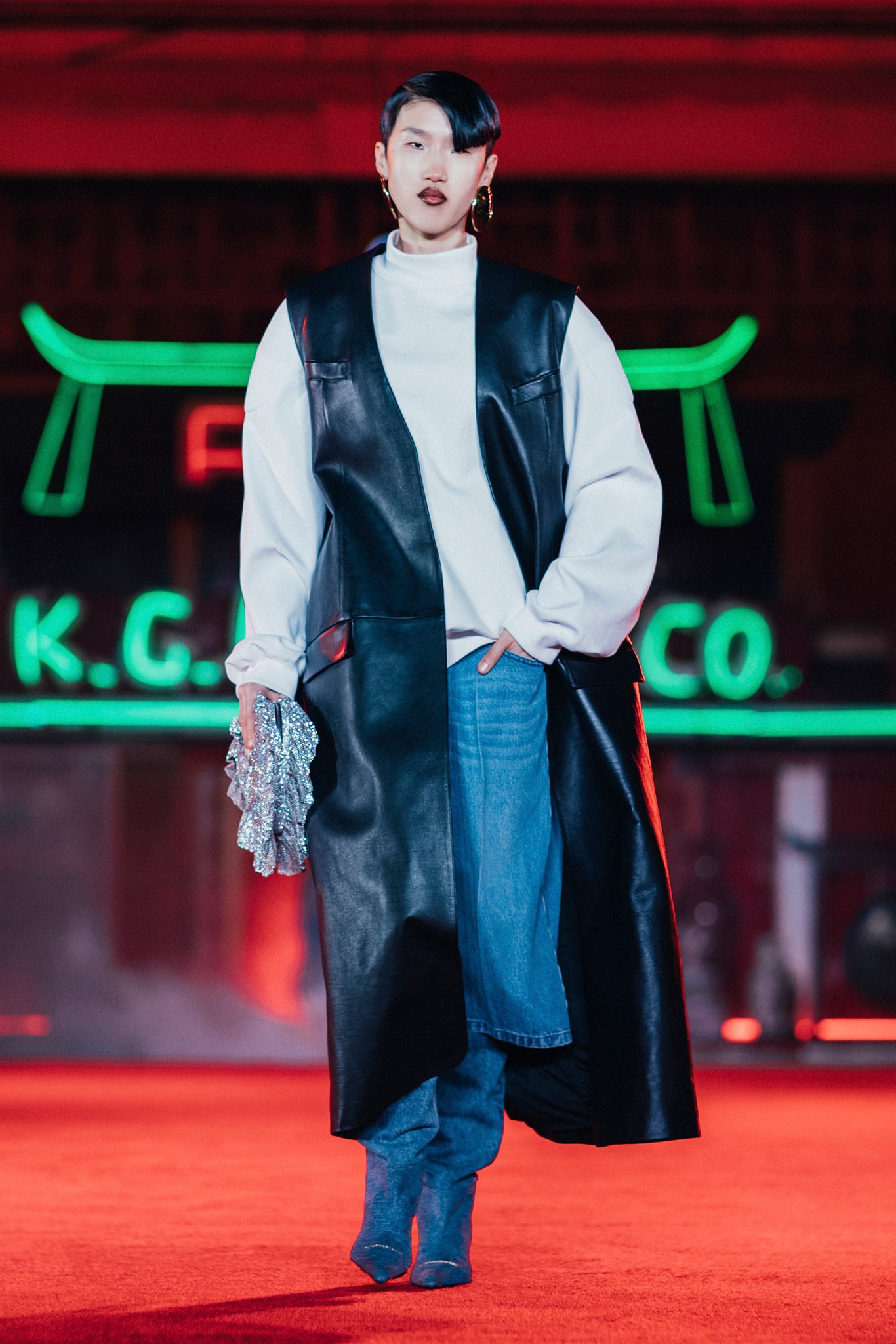 black leather long-sleeve collared fitted layered coat