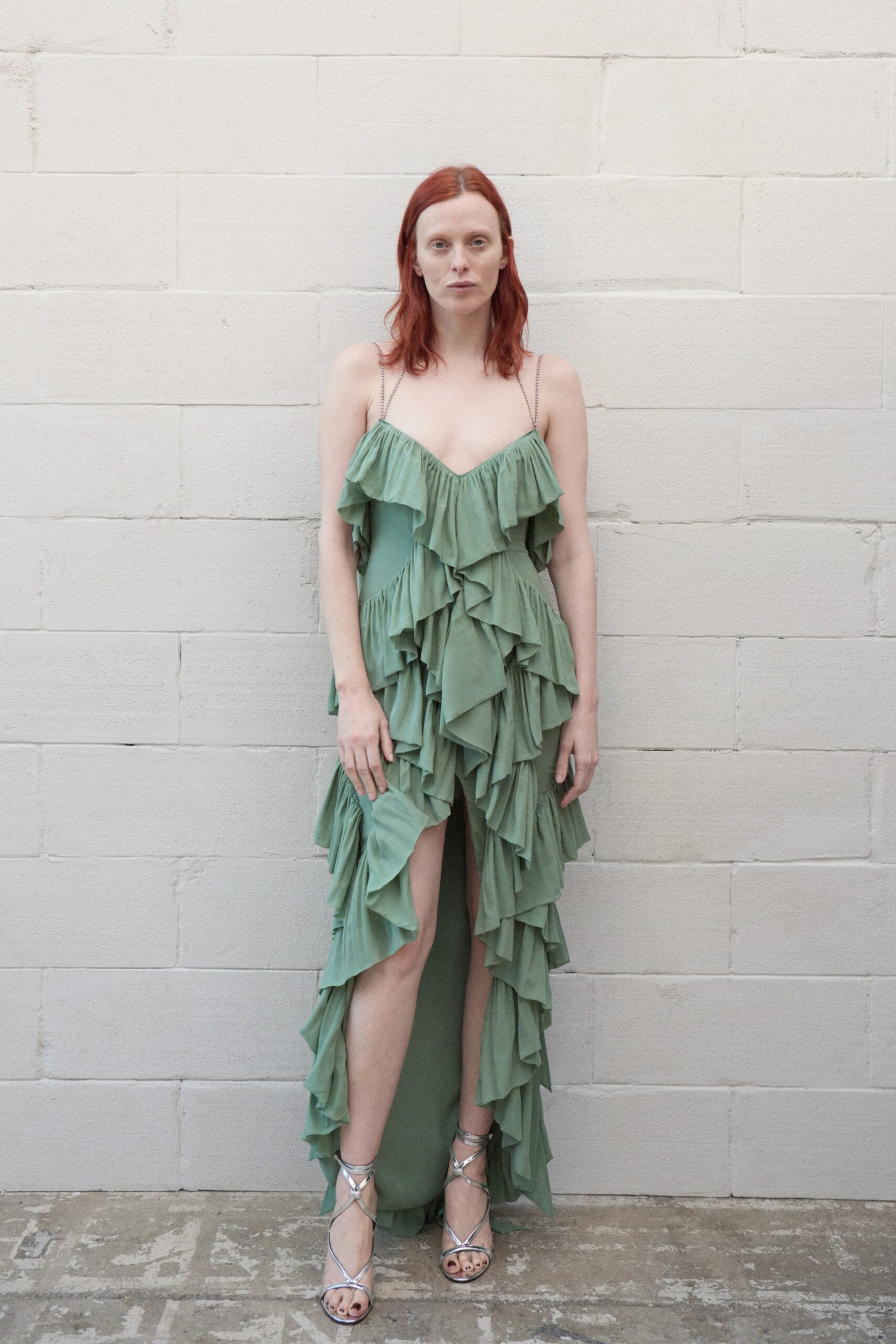 green ruffled midi dress with strappy shoes