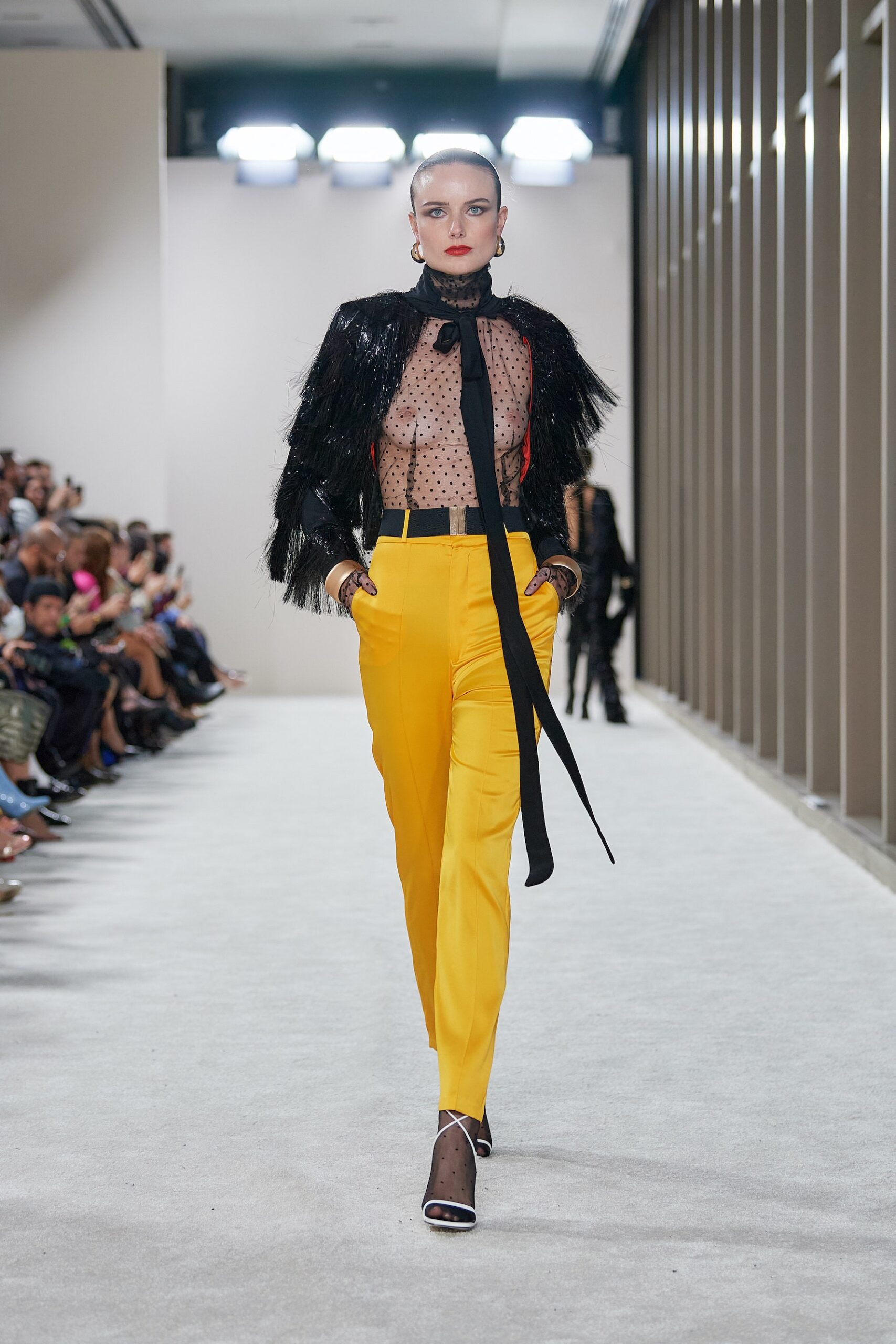 black sheer top yellow tailored pants