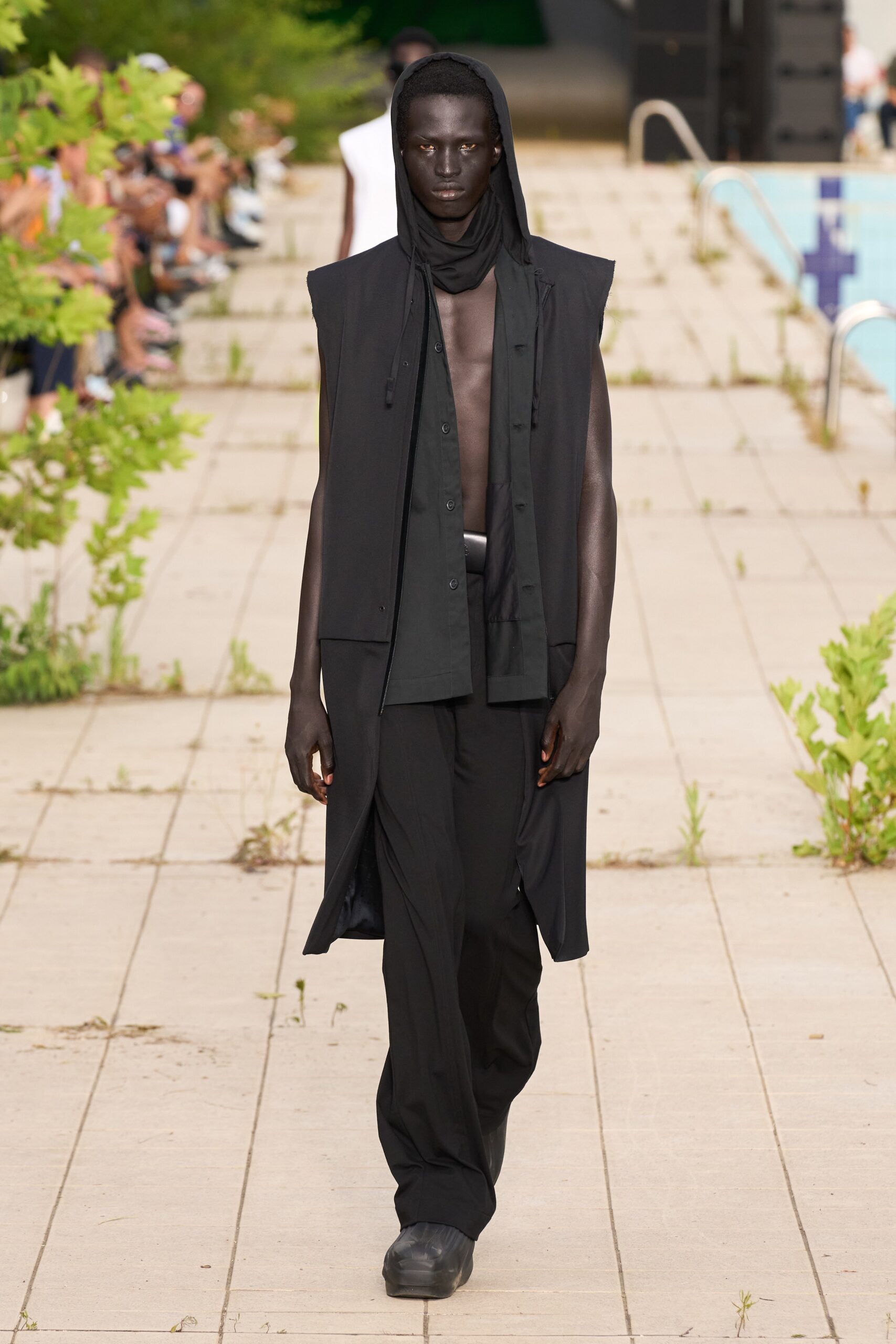 black relaxed coat with fitted shirt