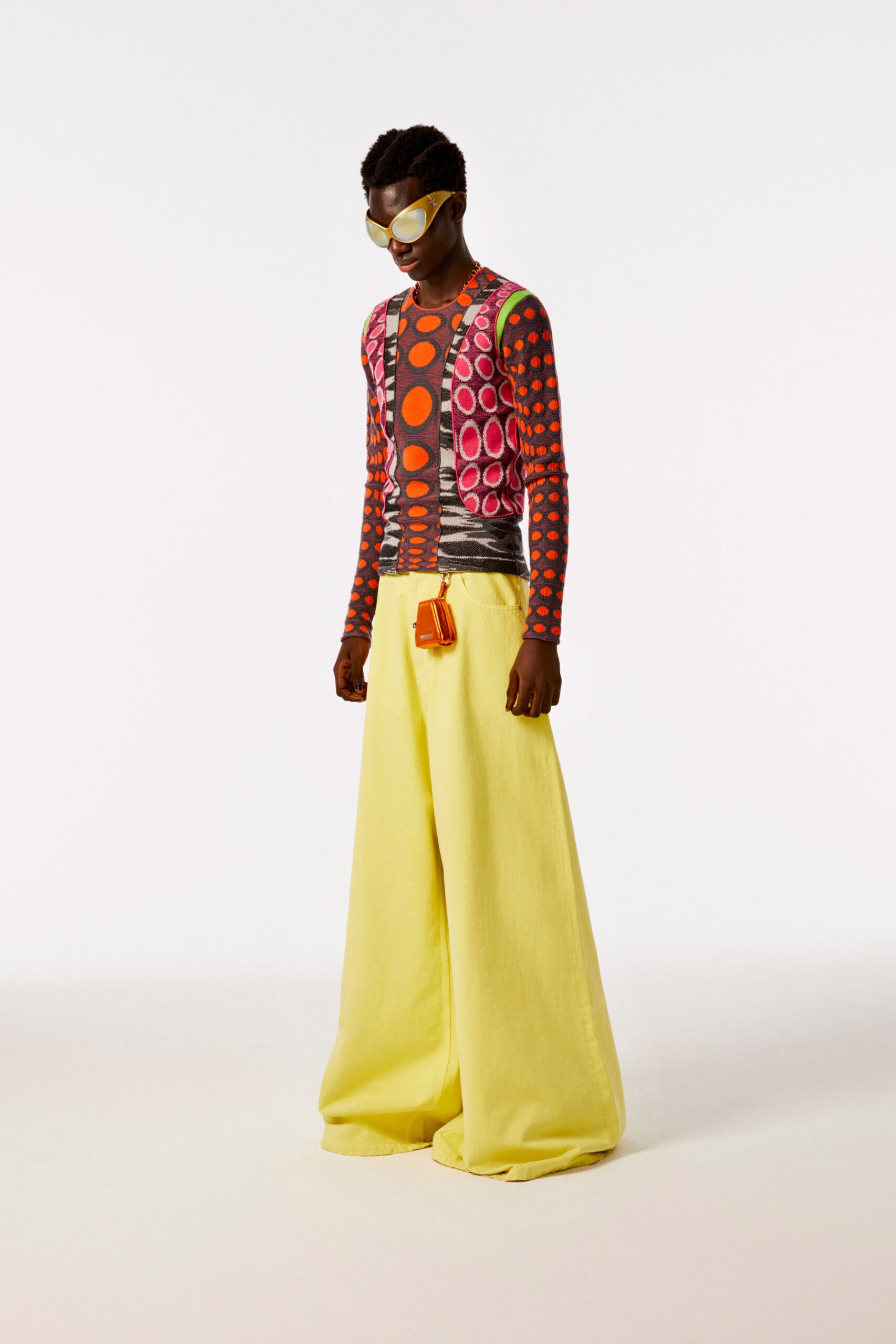 multi-colored printed top and yellow wide-leg pants