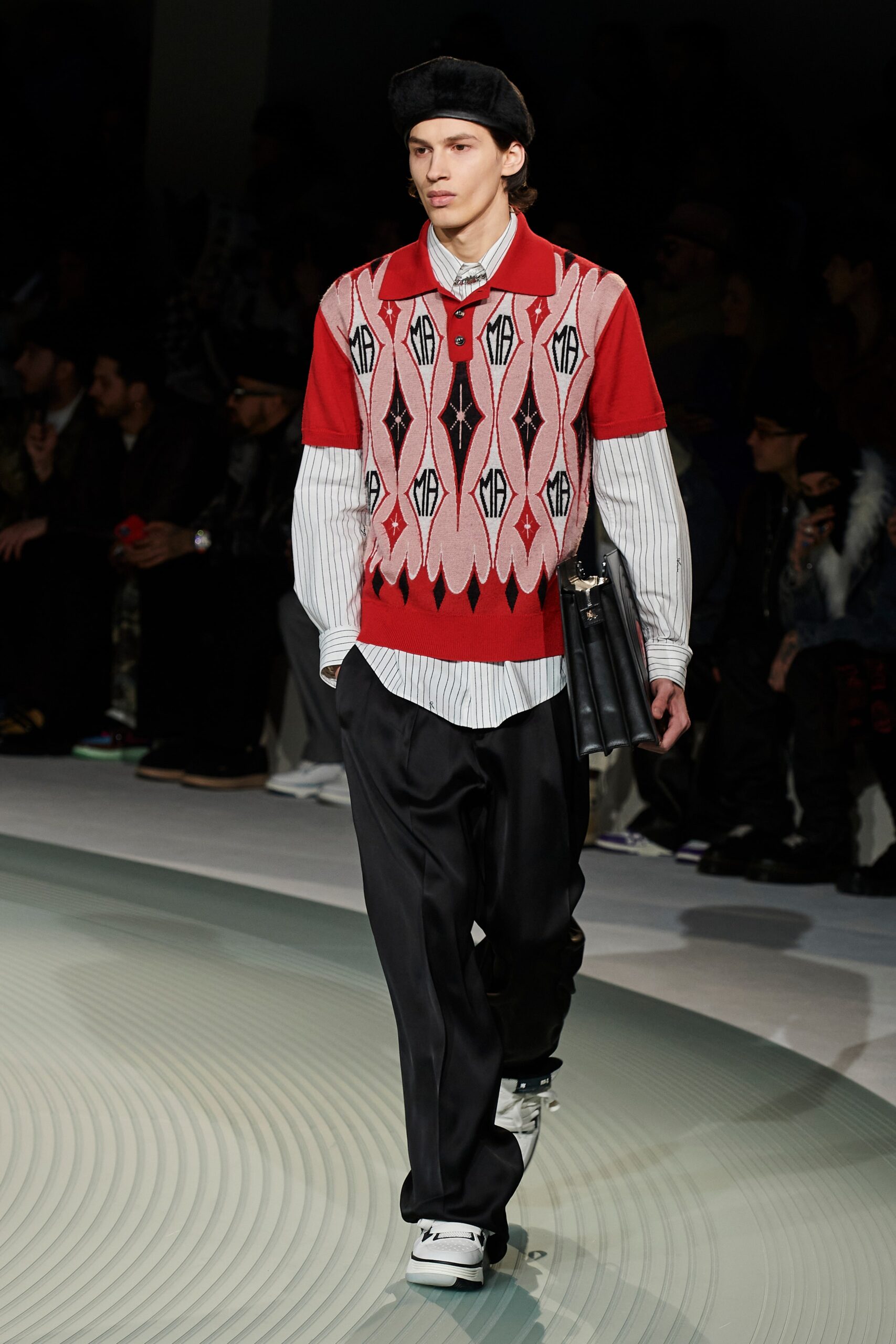 red printed sweater with black pants