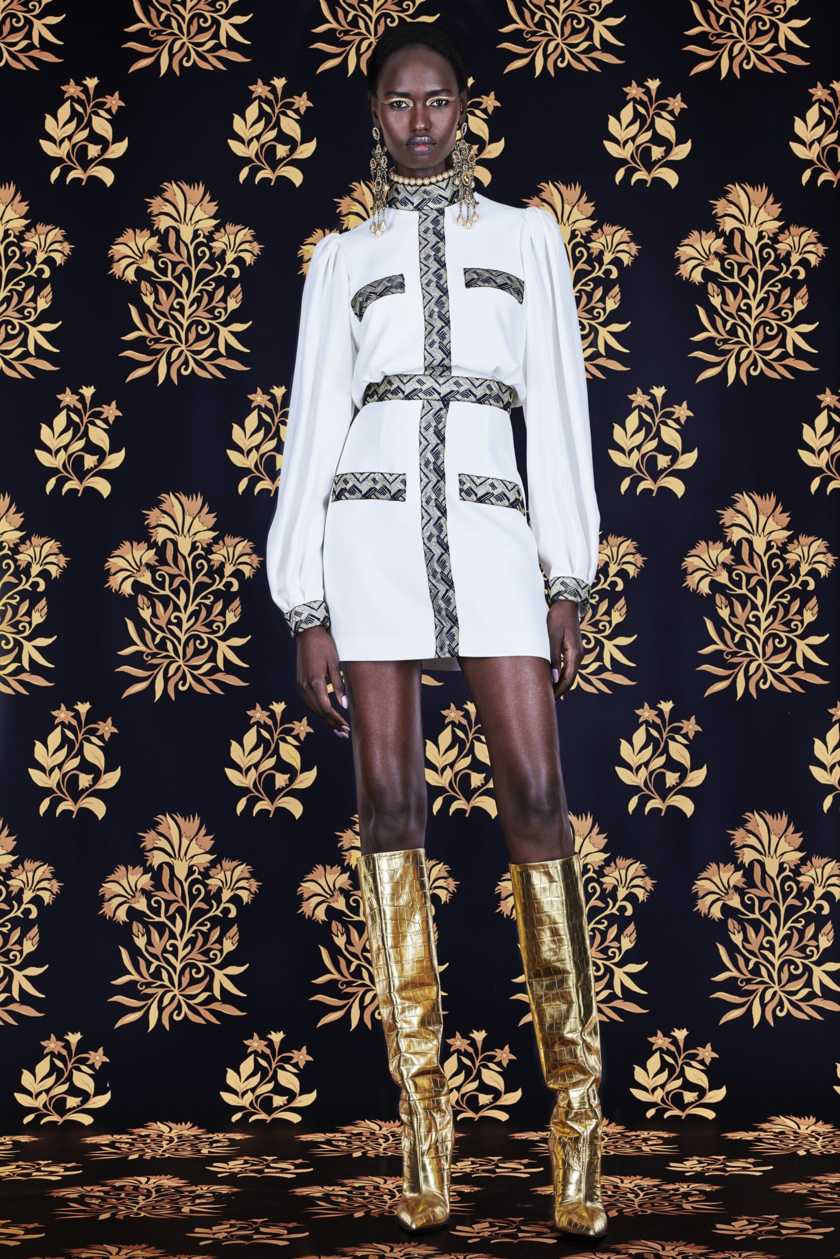 white fitted mini dress with gold boots