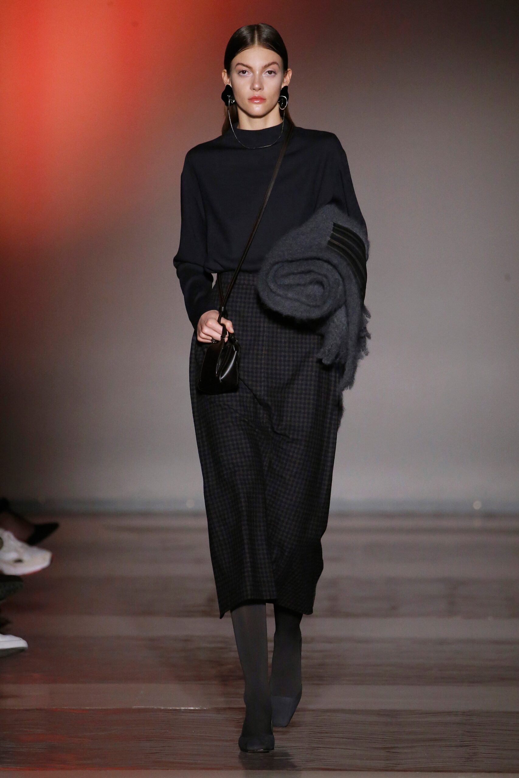 black relaxed top and midi skirt