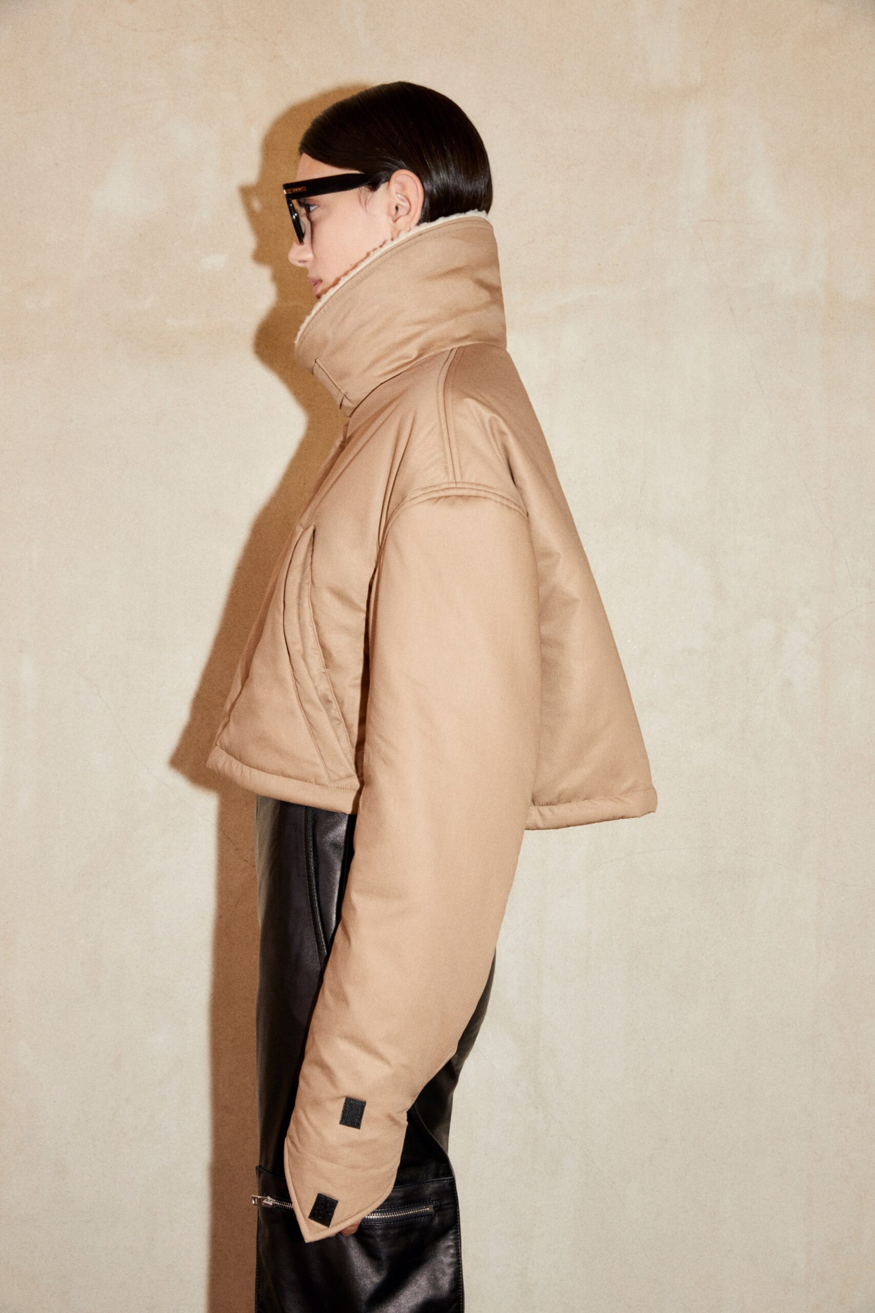 beige oversized jacket and black leather pants
