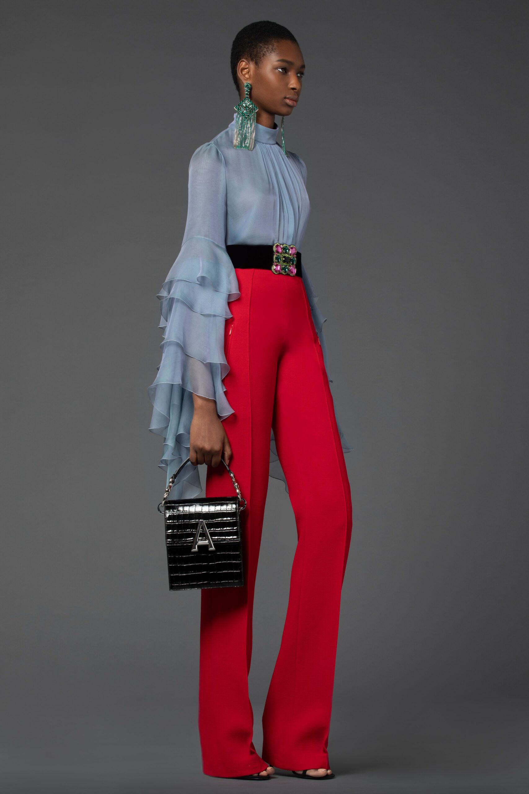 blue silk ruffled blouse and red pants
