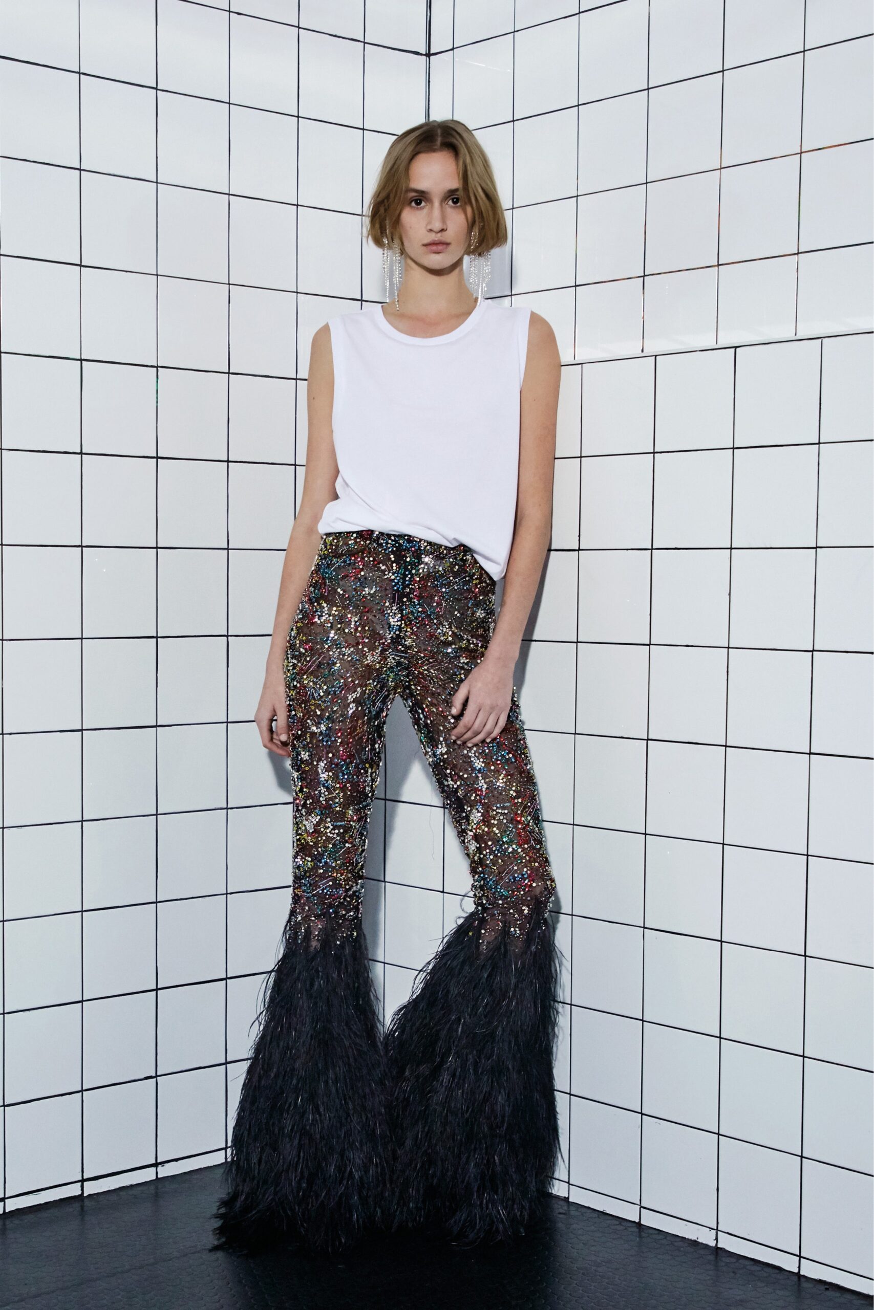 white sleeveless top with multi sequin pants