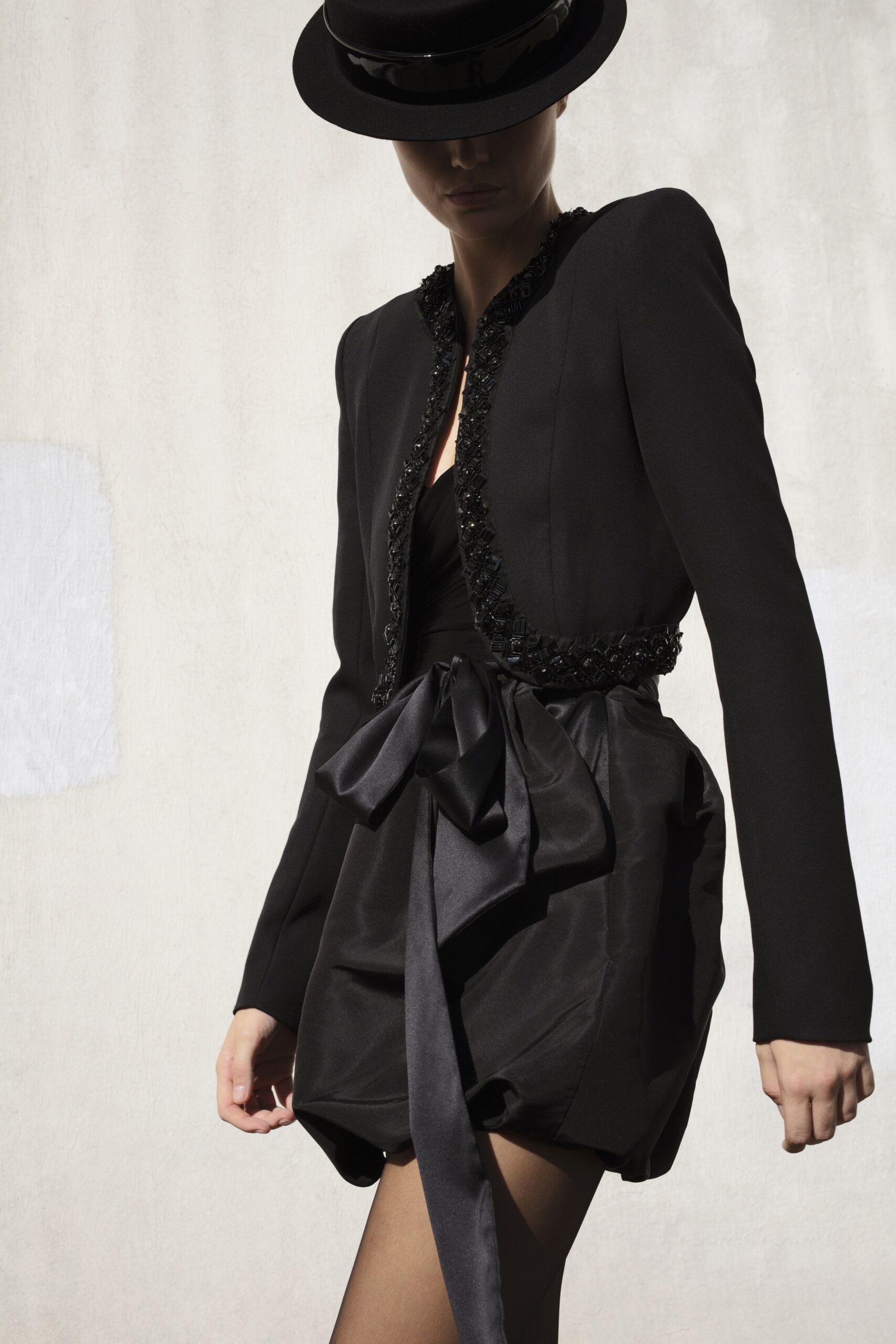 black silk sleeveless v-neck fitted pleated belted dress