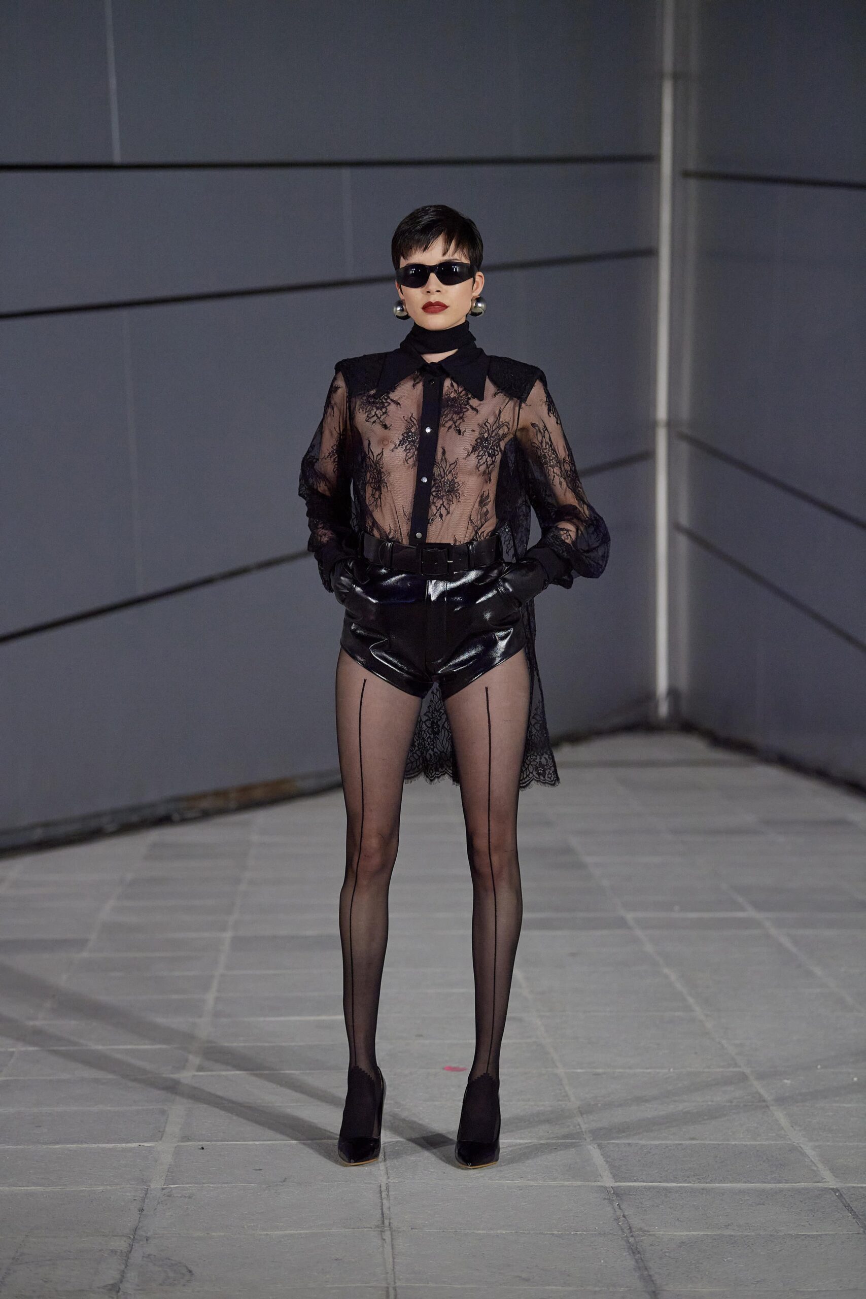 black lace blouse with vinyl shorts