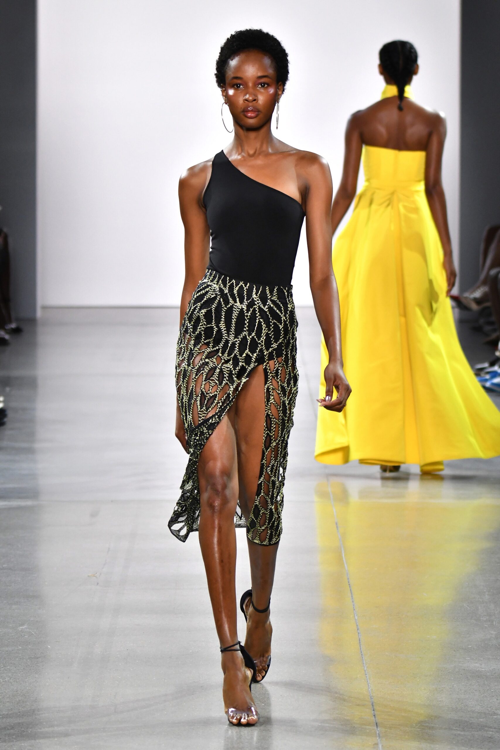 black one-shoulder top with gold embroidered skirt