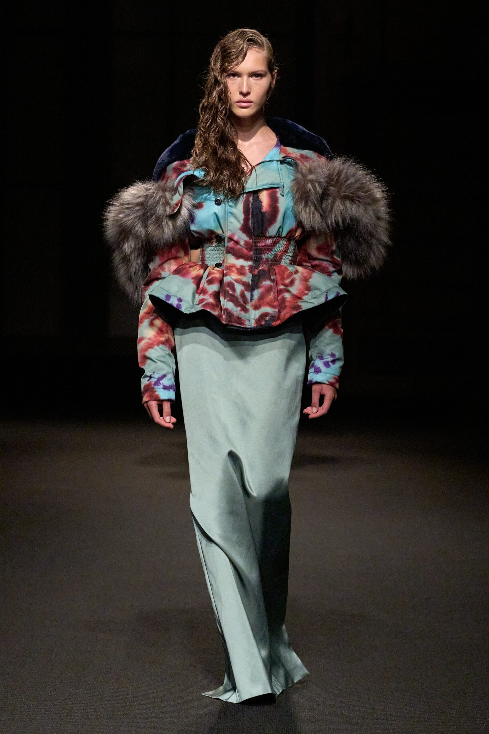 multi-colored structured jacket and green skirt