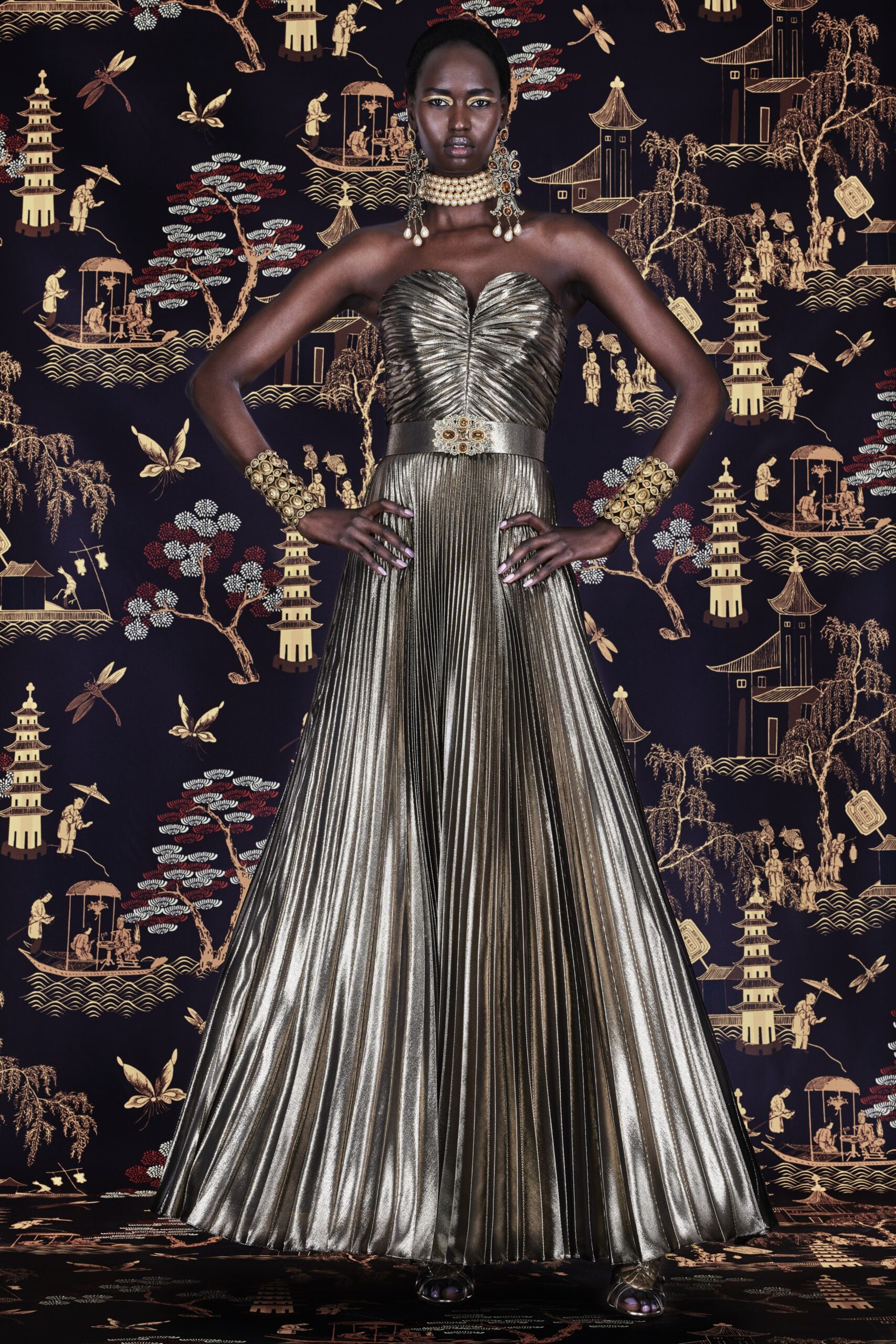 gold pleated strapless gown