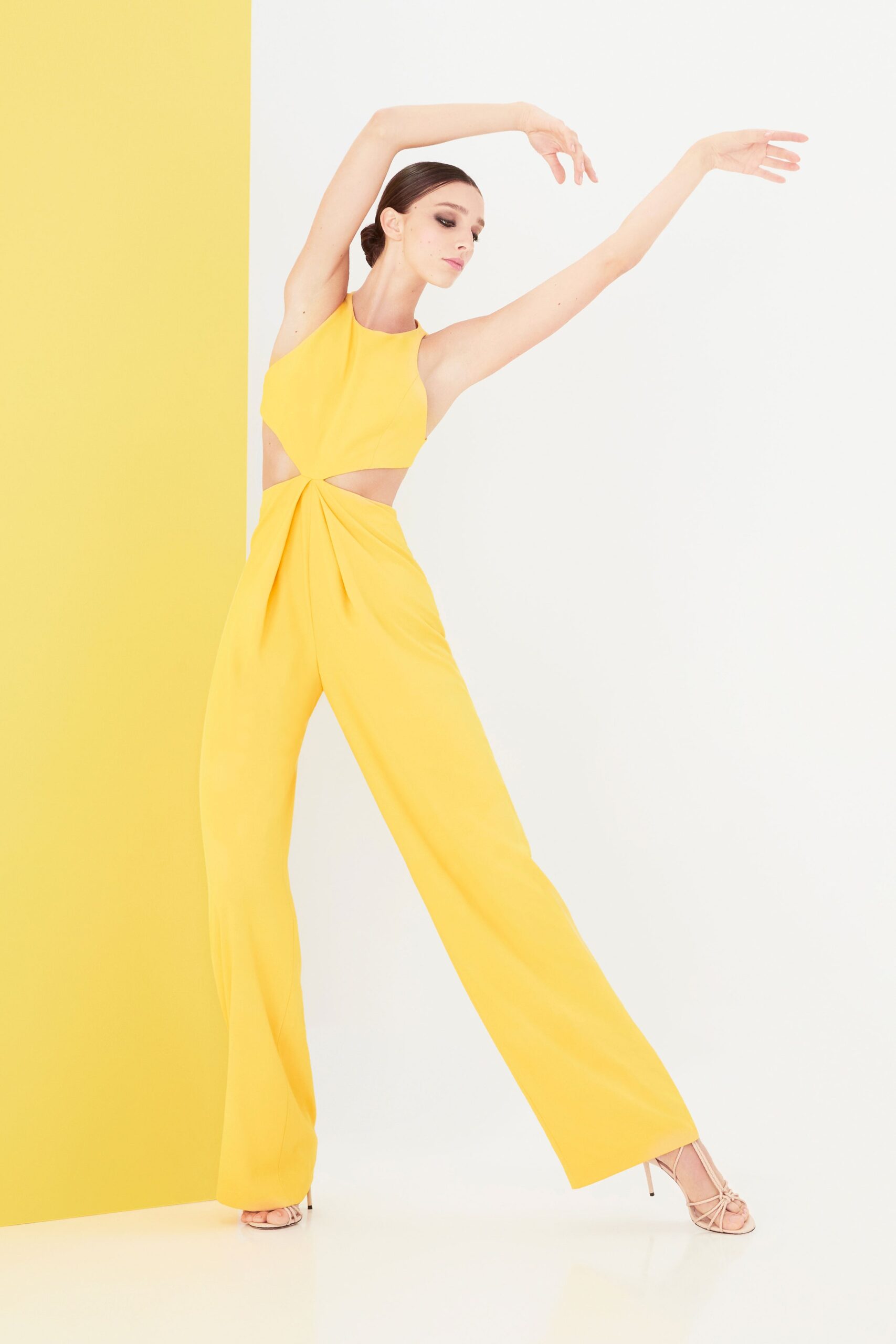 yellow fitted jumpsuit with cutouts