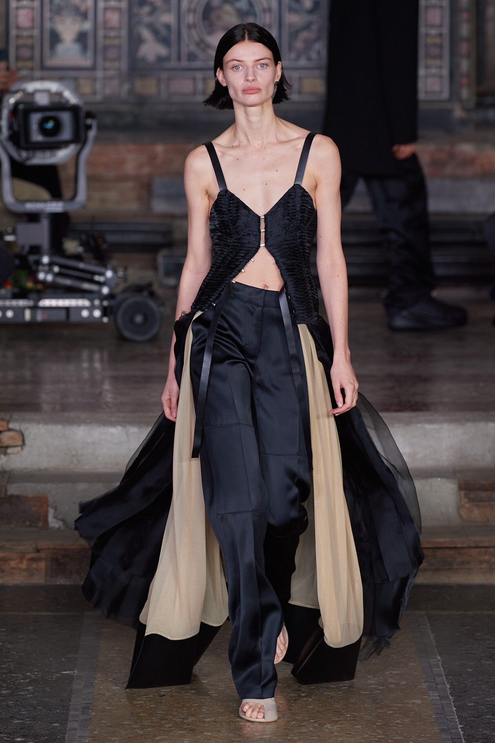 black silk fitted top with wide-leg pants