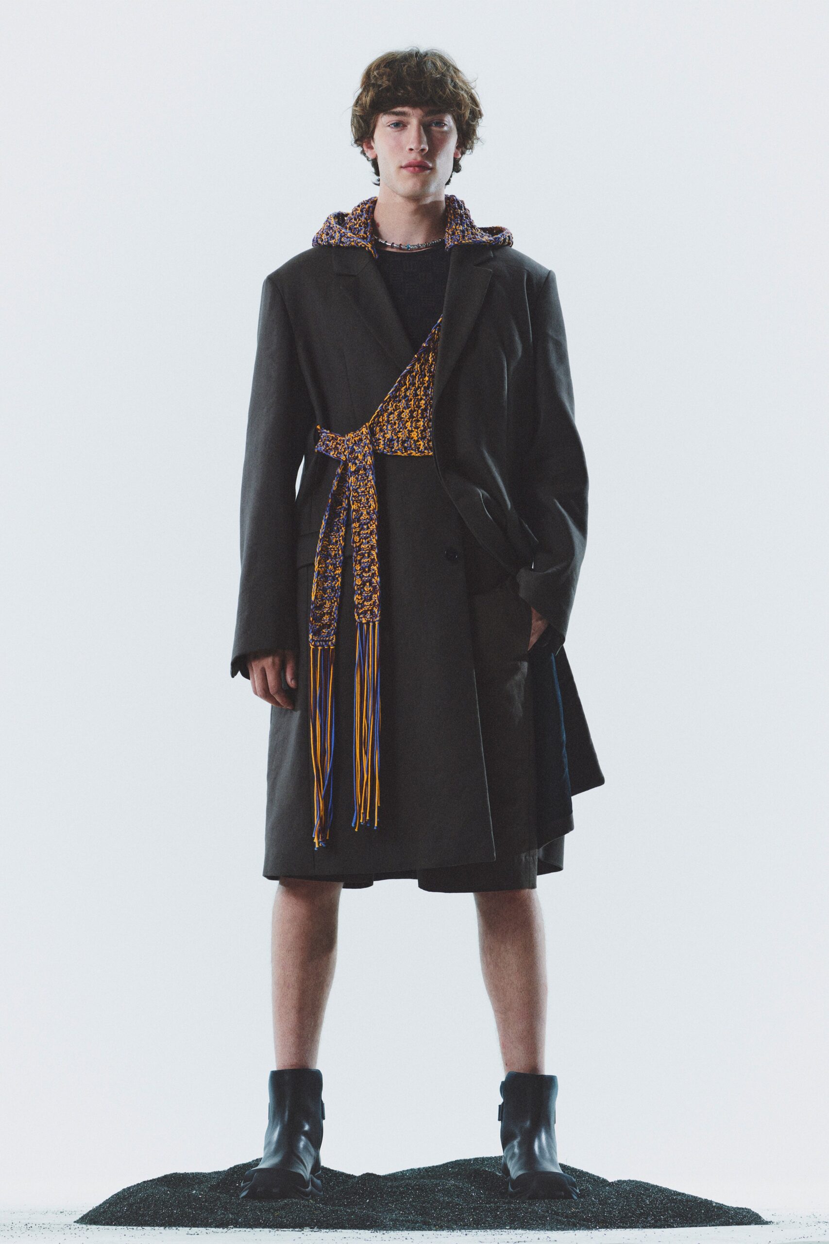 black wool coat with embroidered top