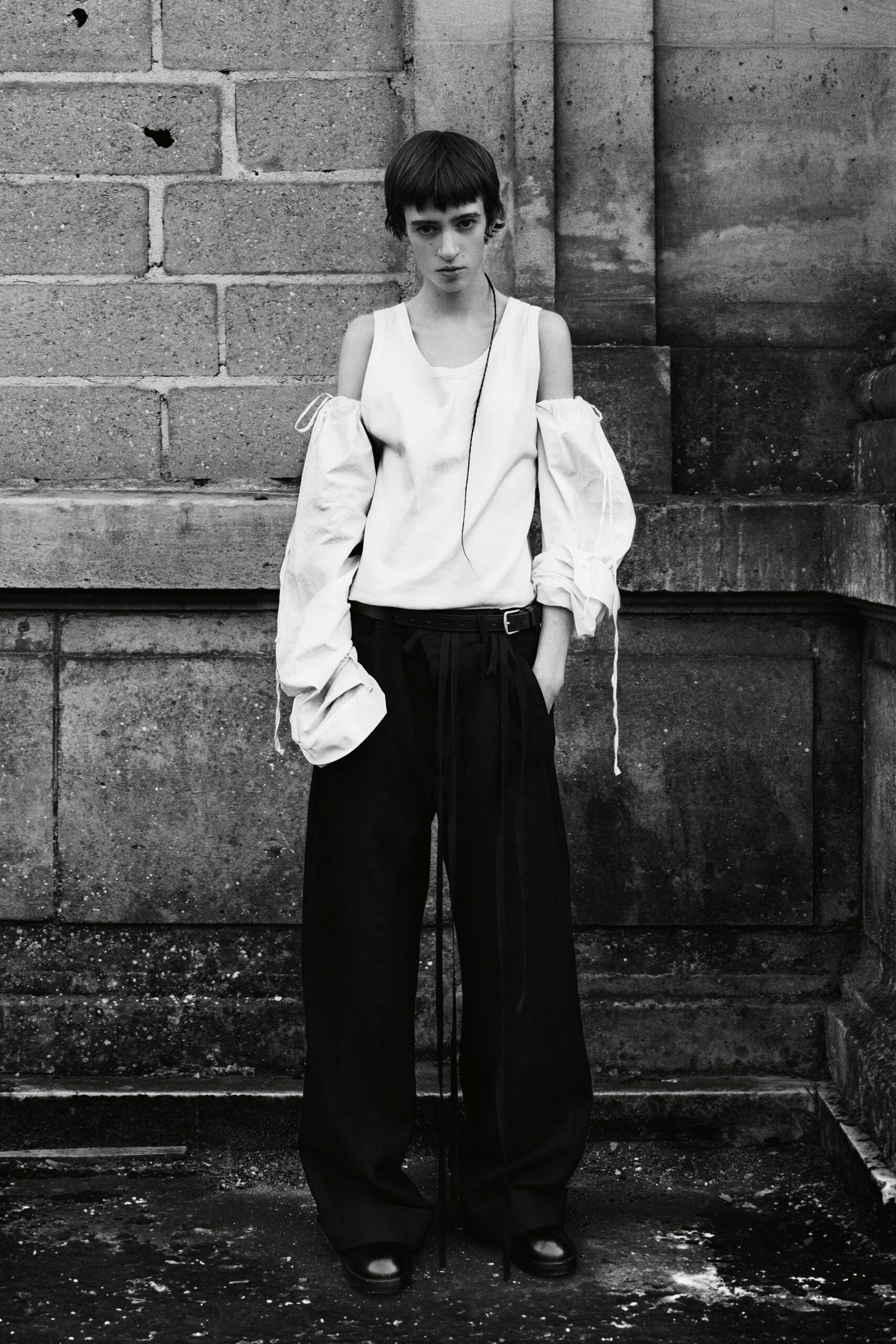 white off-shoulder top with black pants