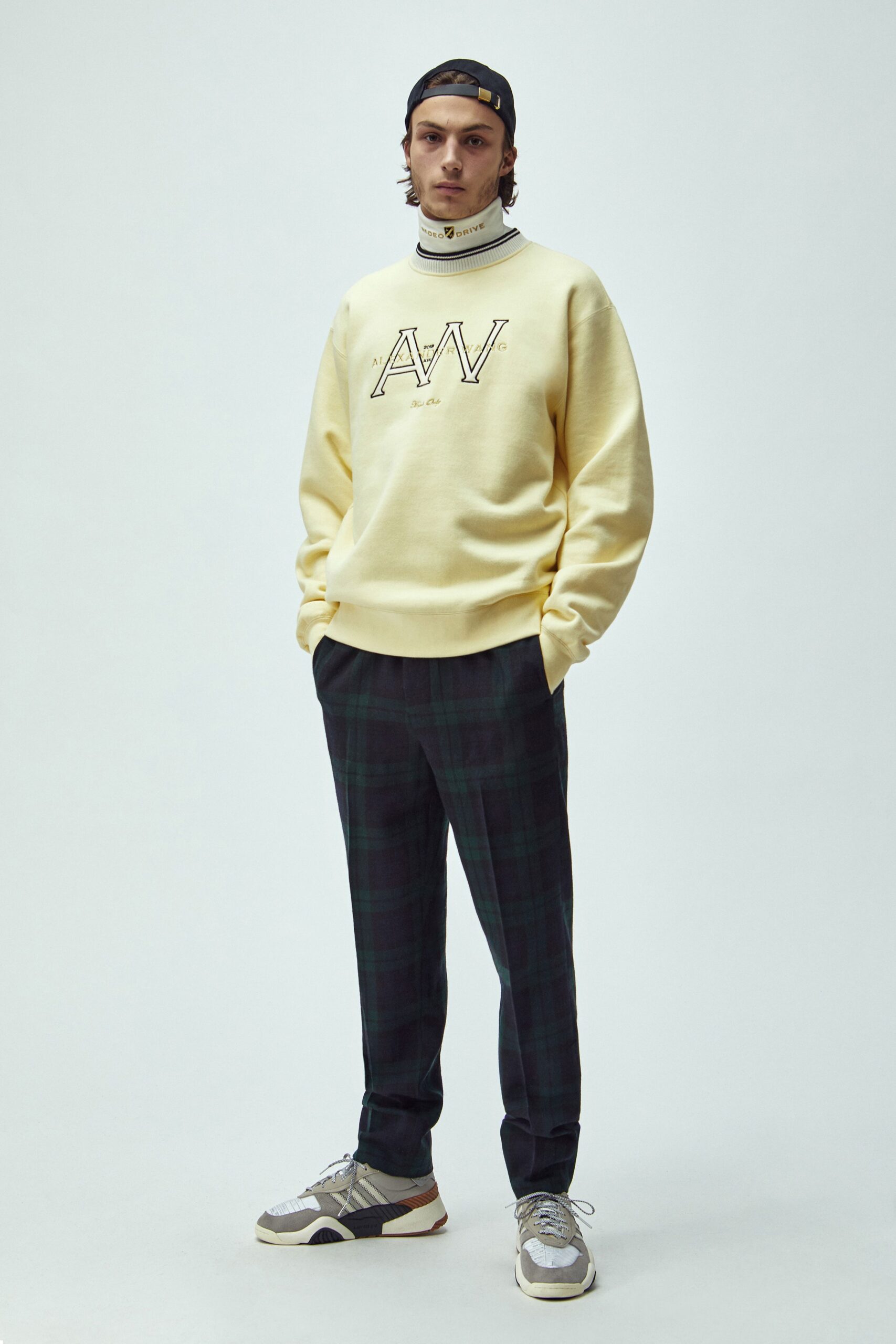yellow relaxed sweater and green checked pants