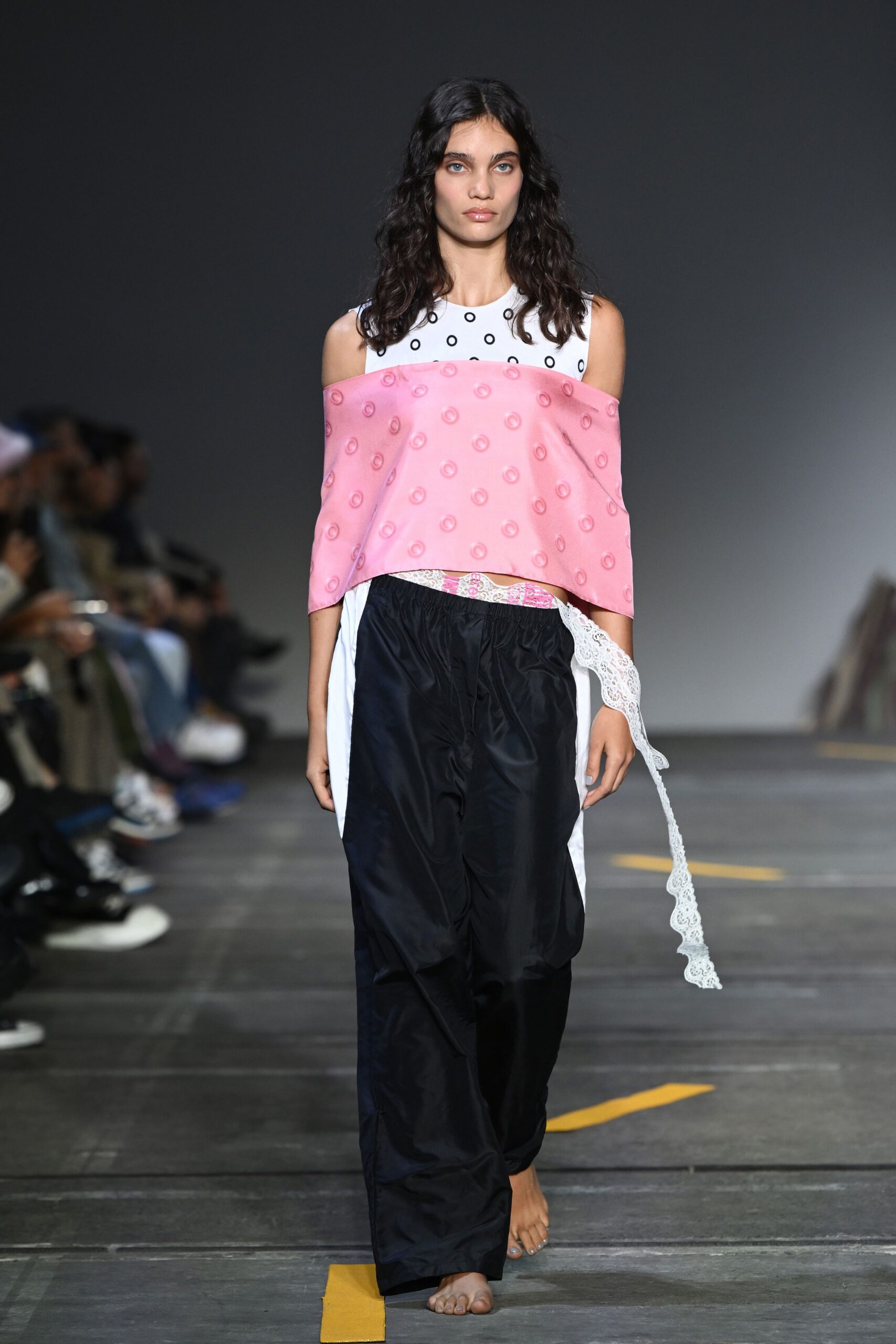 white pink off-shoulder top with black pants