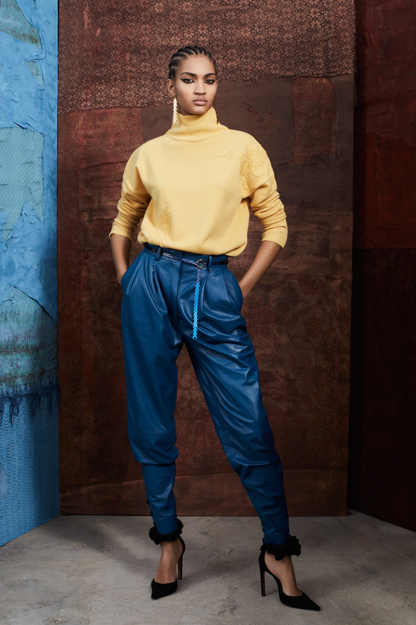 yellow turtleneck sweater with blue pants
