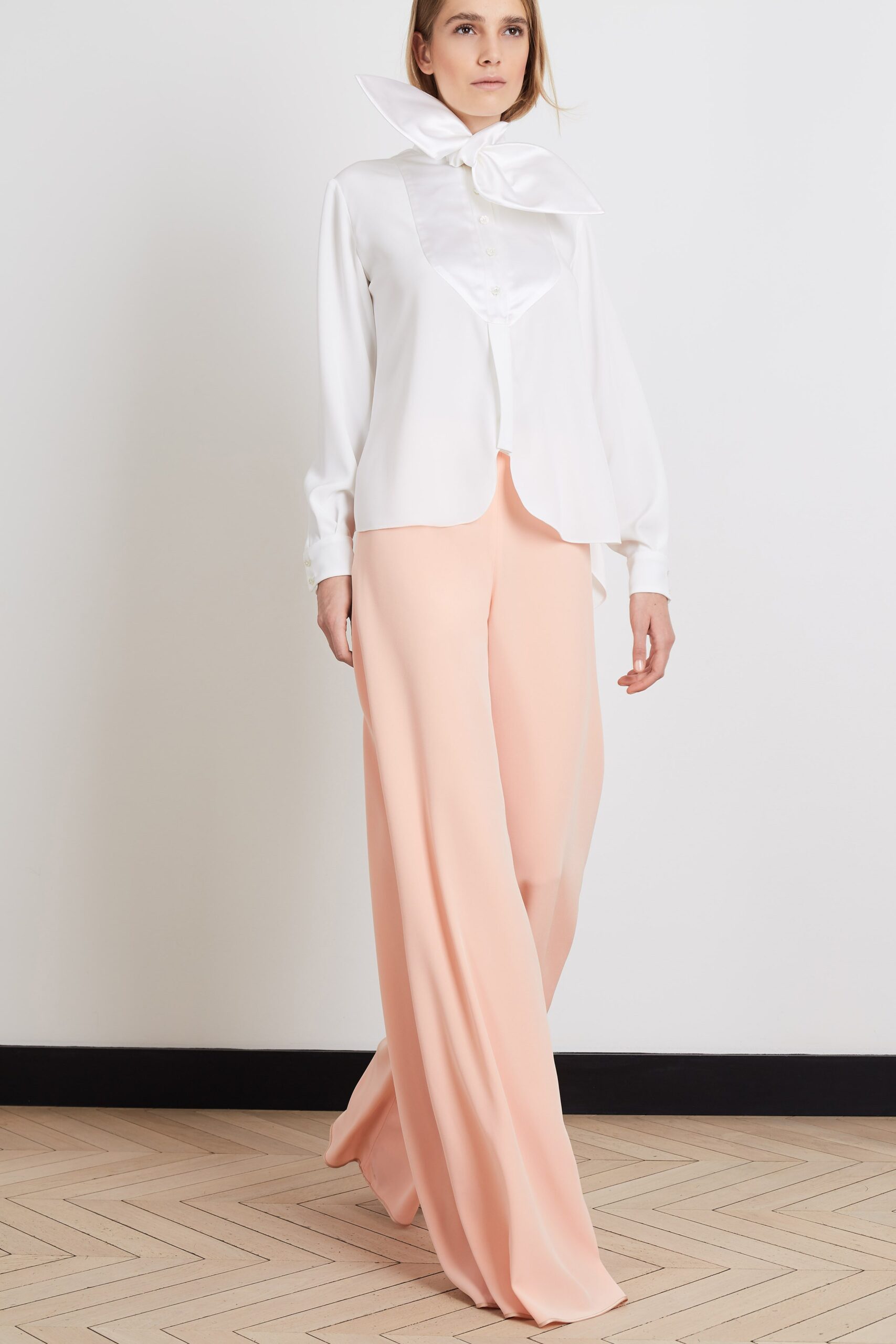 white silk blouse with pink pants