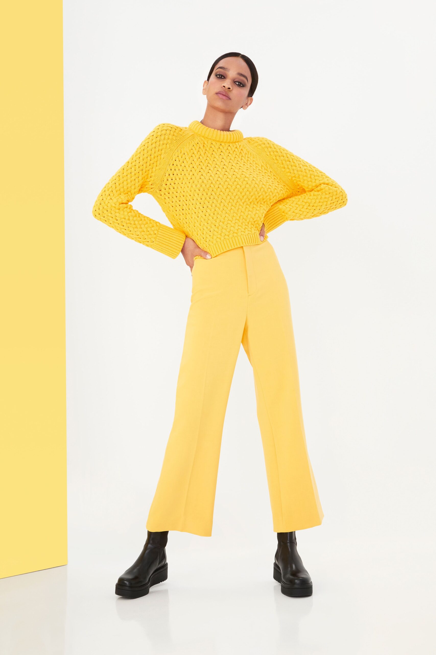 yellow sweater and tailored pants